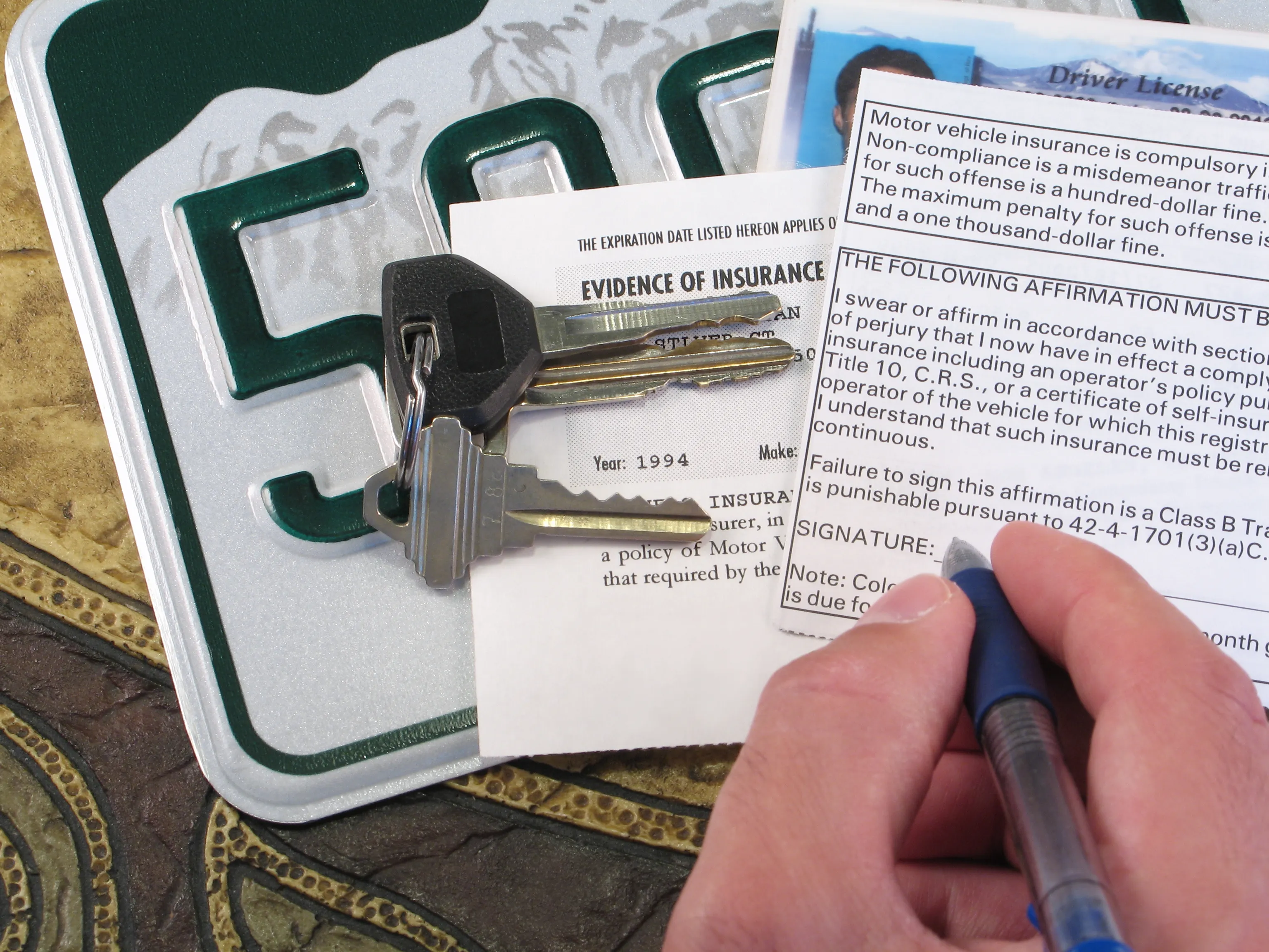 how to get your car insurance to go down