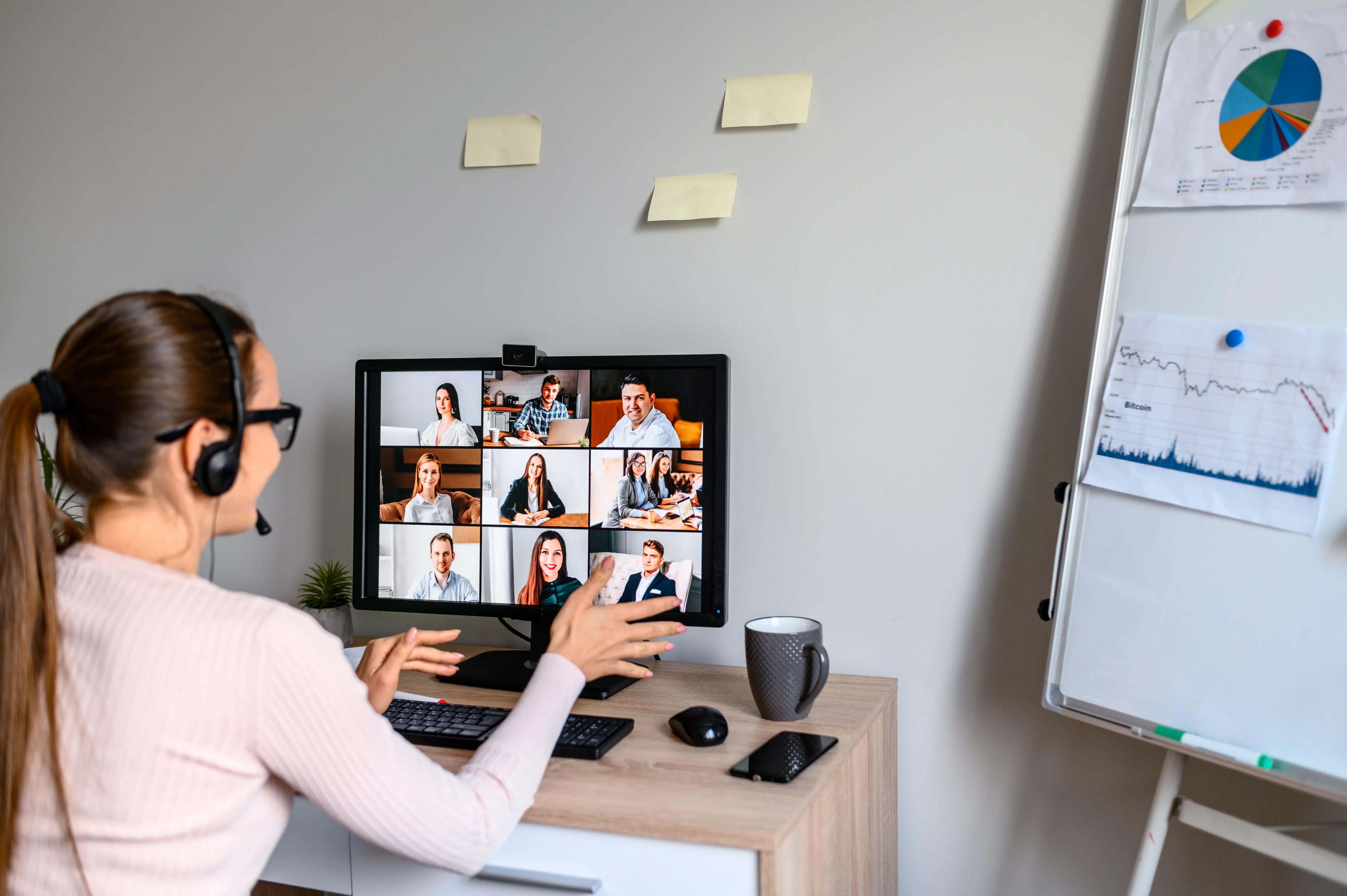 Young woman working with team from home