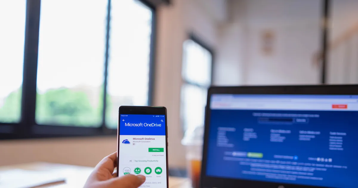 Microsoft OneDrive on smartphone and laptop