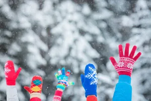 Festive mittens in the air