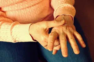 elderly hands with joint pain