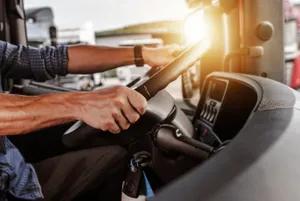 hands on truck steering wheel