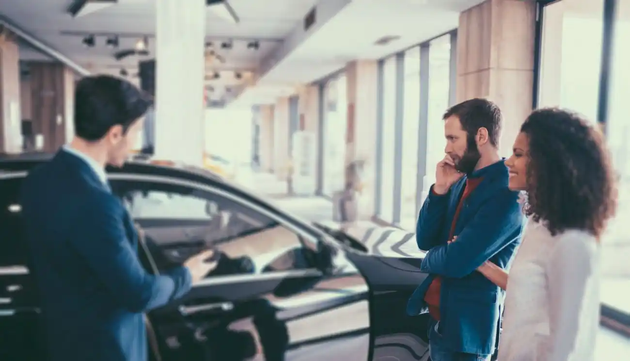 Couple Picking a New Vehicle at Dealership
