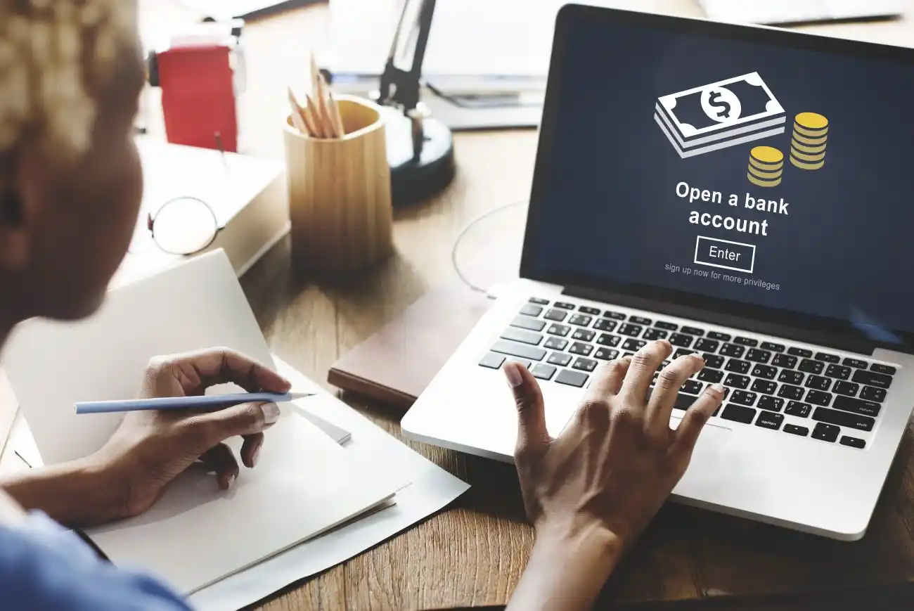 Man Opening Bank Account on Laptop