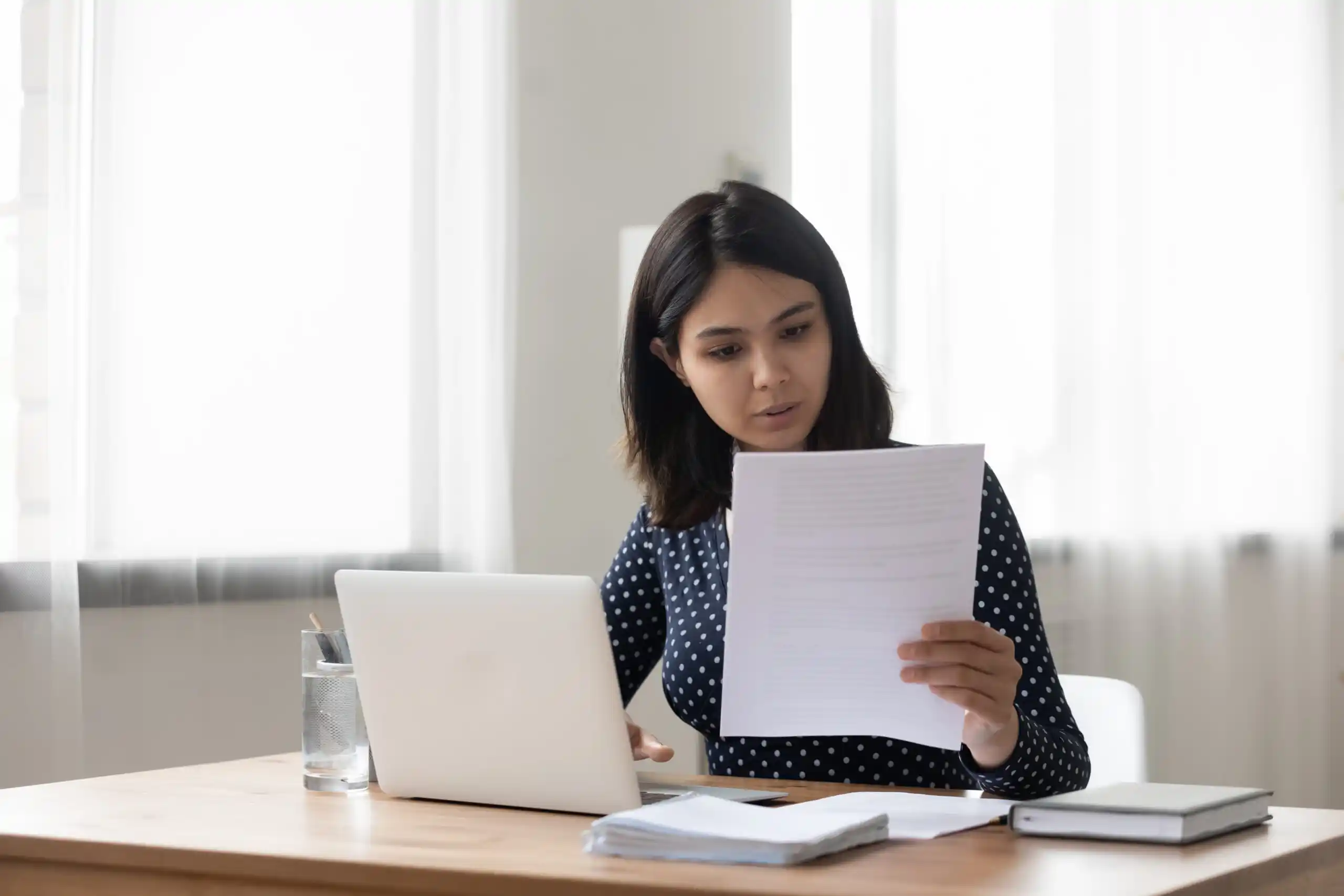 Young woman reading cover letter