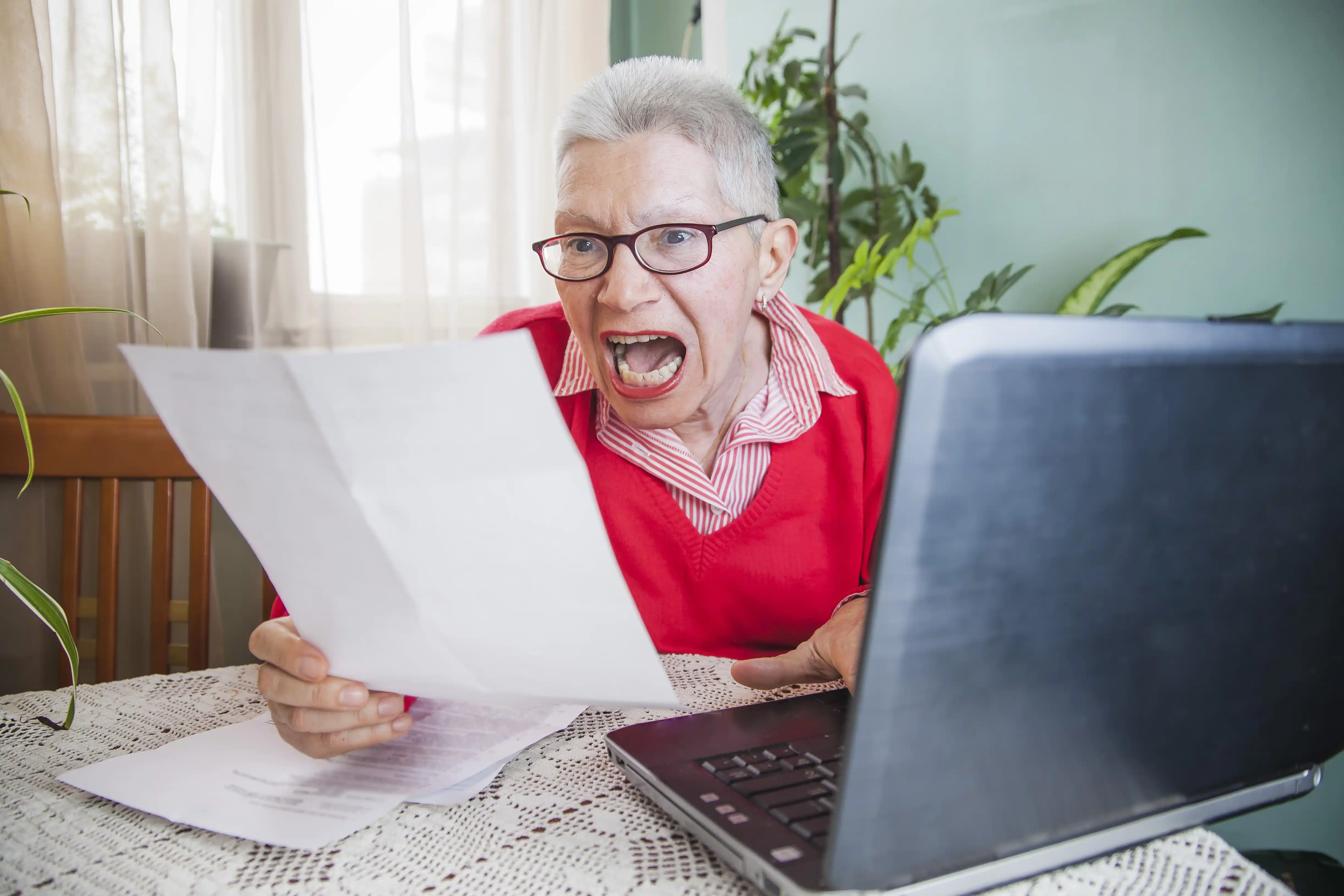 Woman Yelling While Looking at Bill