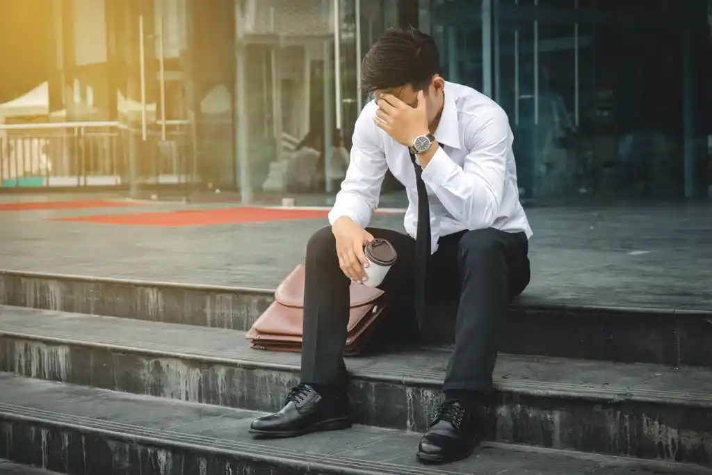 Unemployed Man Sad on Steps
