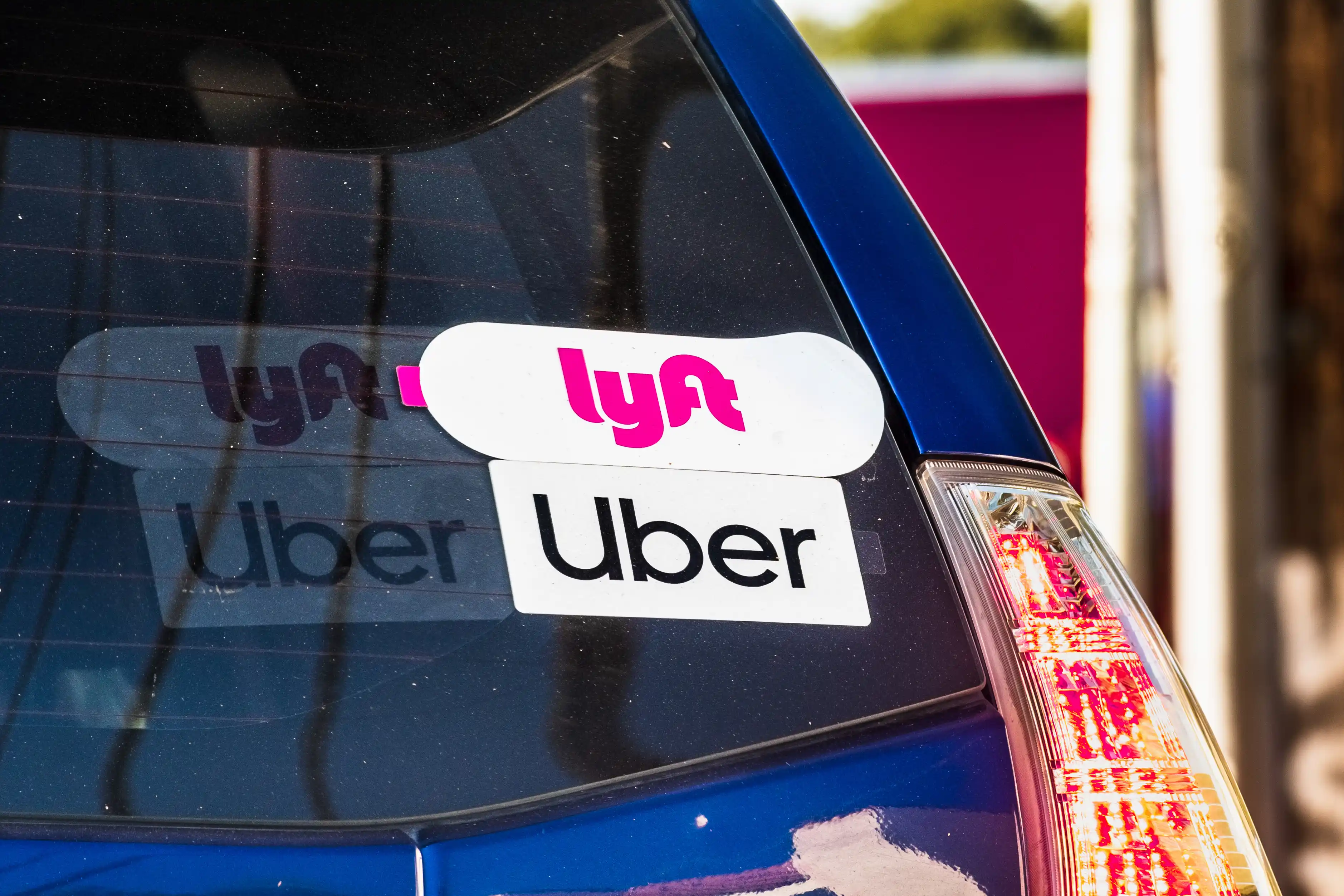 Car with Uber and Lyft Sticker on it