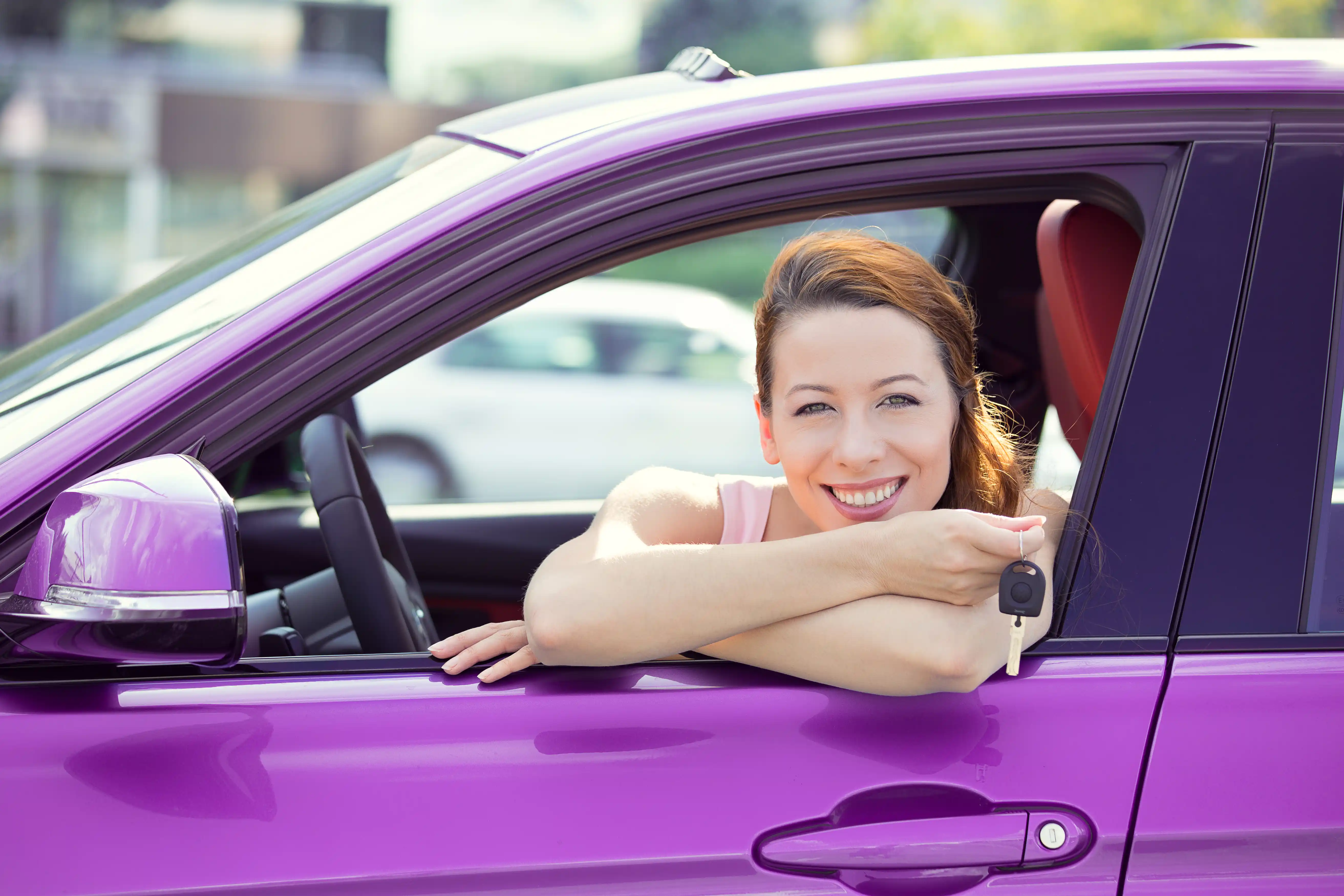 Woman Excited with New Purple Car