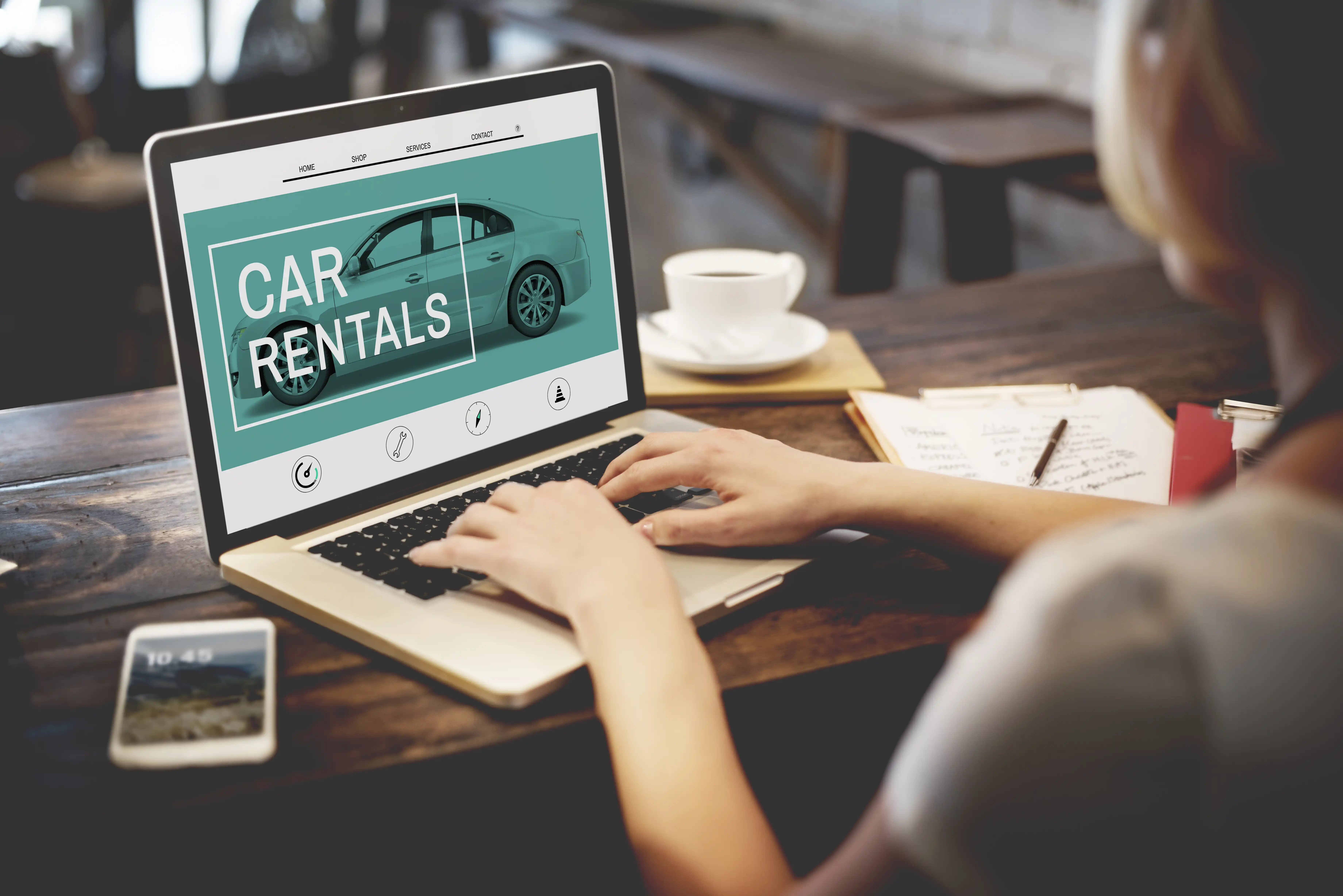 Woman Looking at Car Rental Website