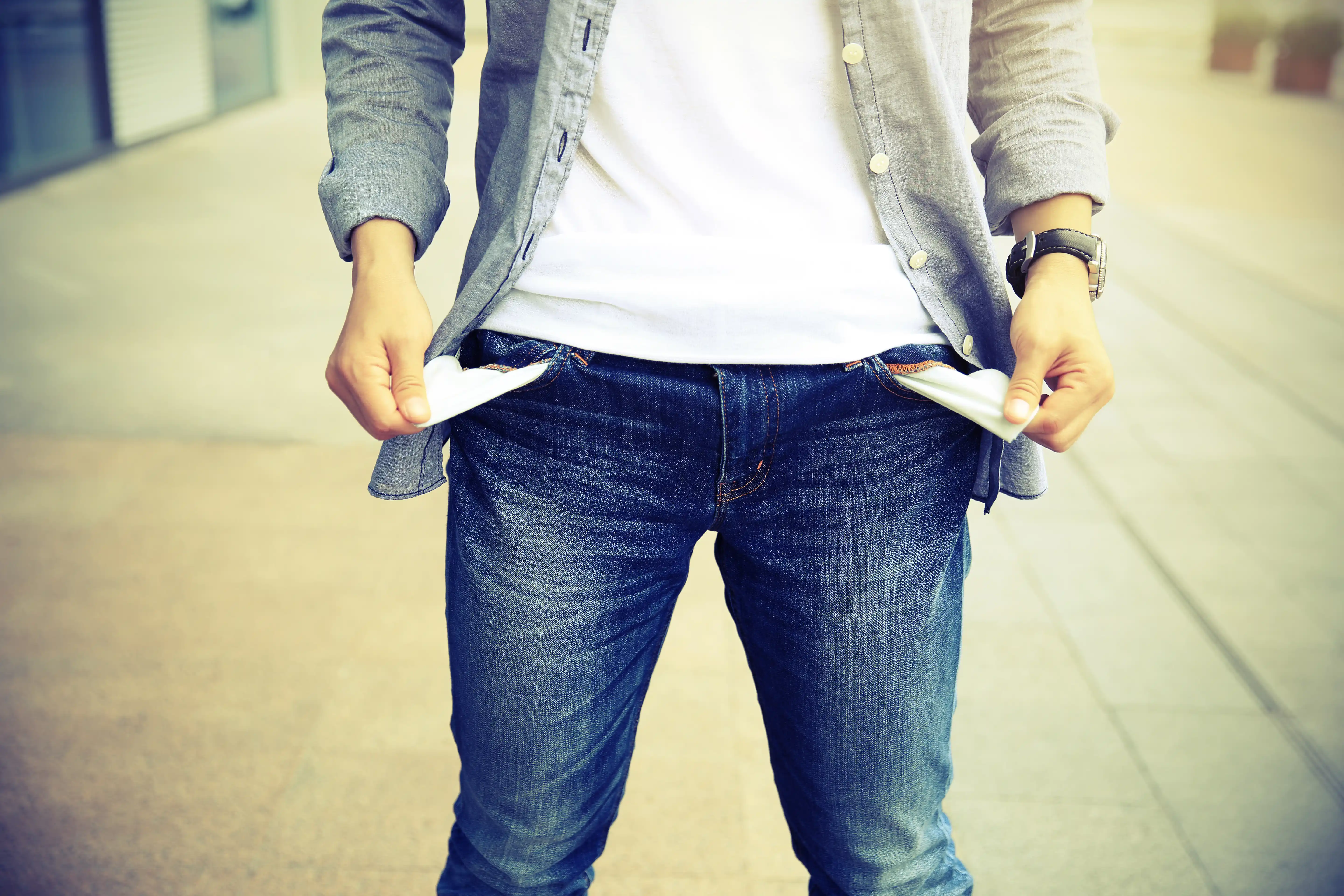 Man Showing Empty Pockets