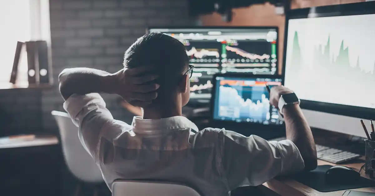 Man Alone Investing on Computer