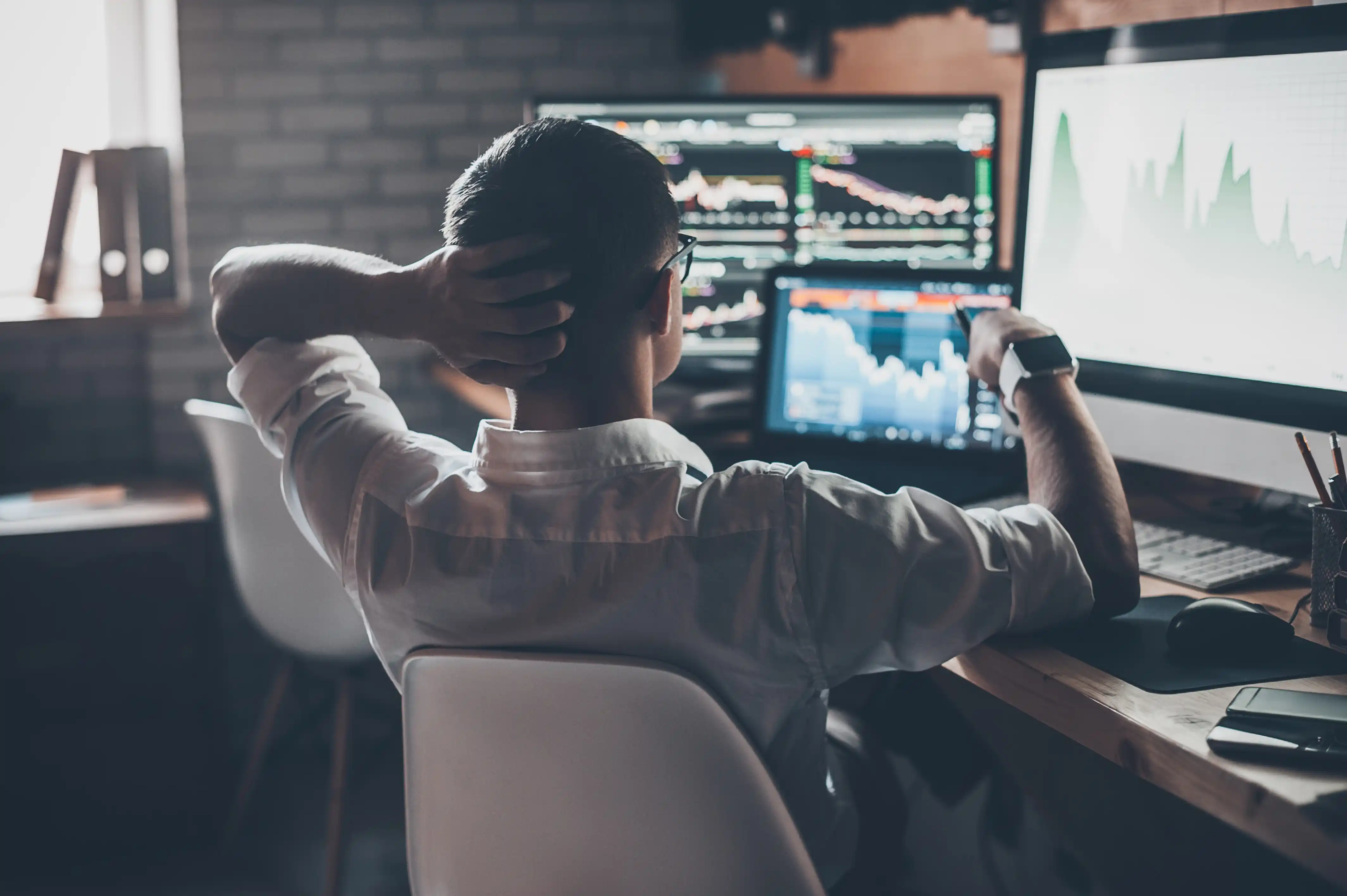 Man Alone Investing on Computer