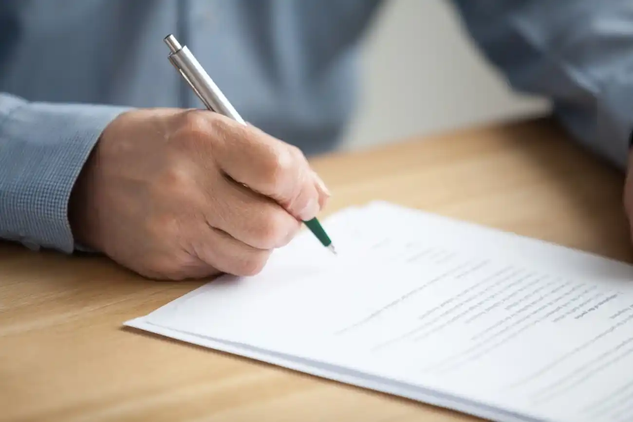 Elderly Hand Signing Documents