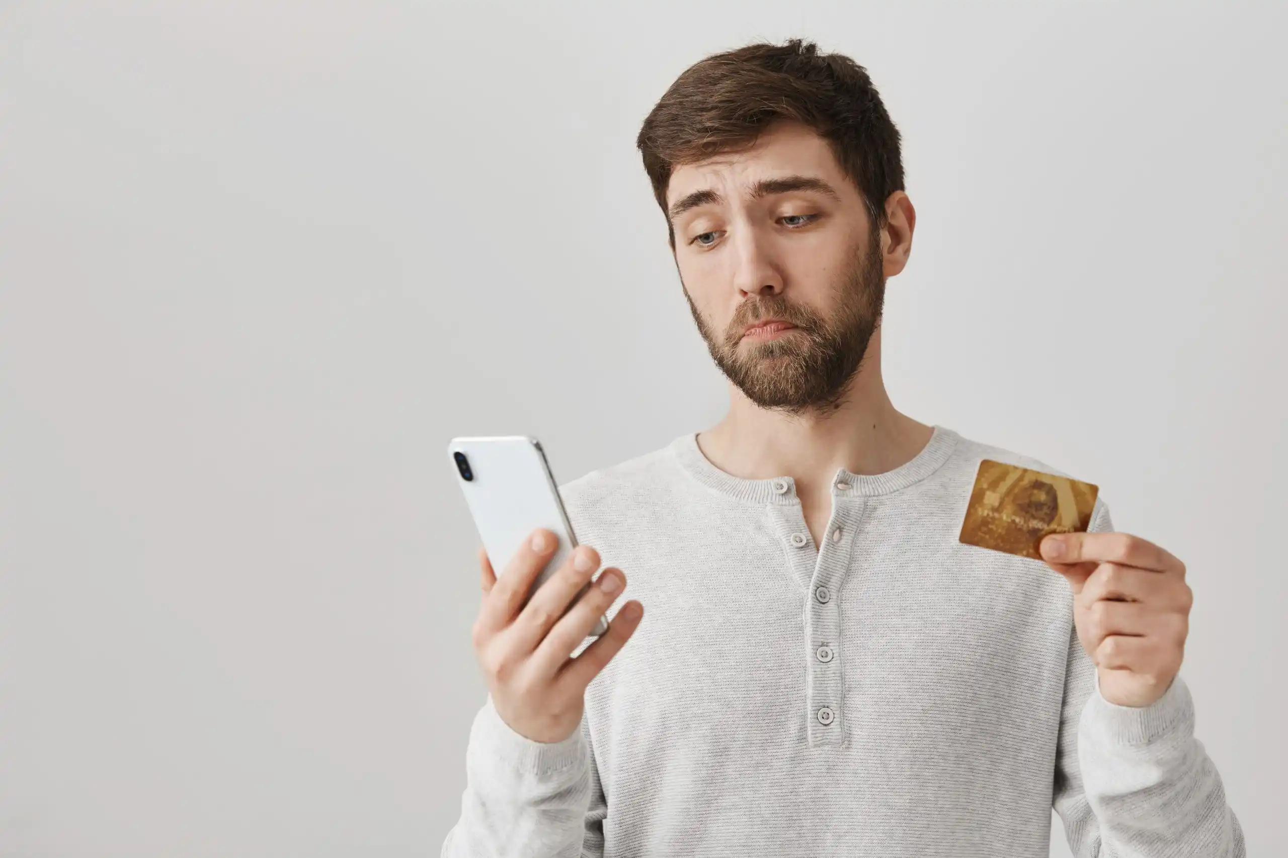 Man with Credit Card and Phone