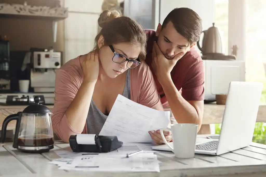Couple Looking Over Taxes in Kitchen