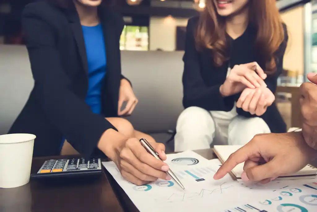 Couple Discussing Chart with Financial Advisor