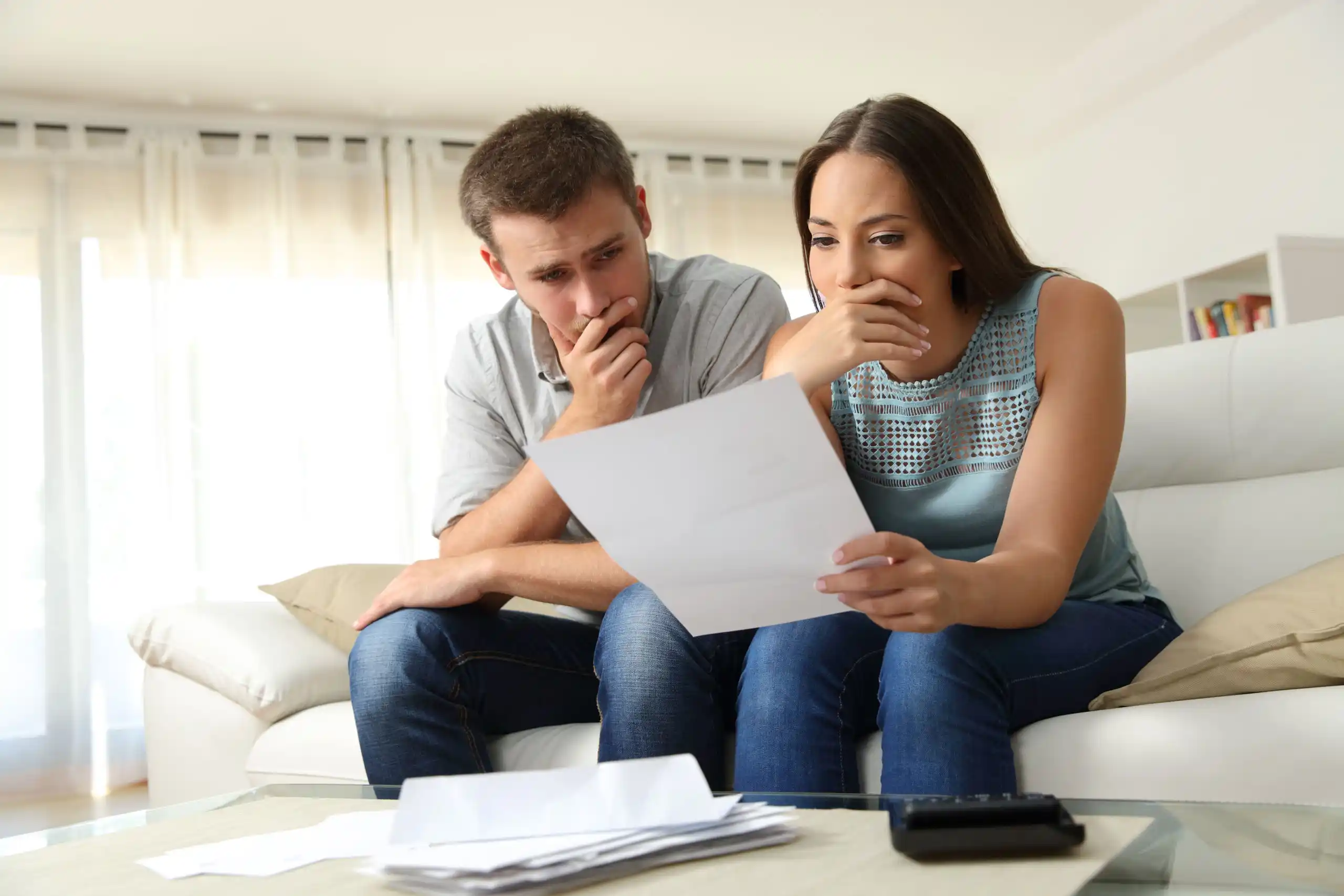 Couple Studying Bankruptcy Documents