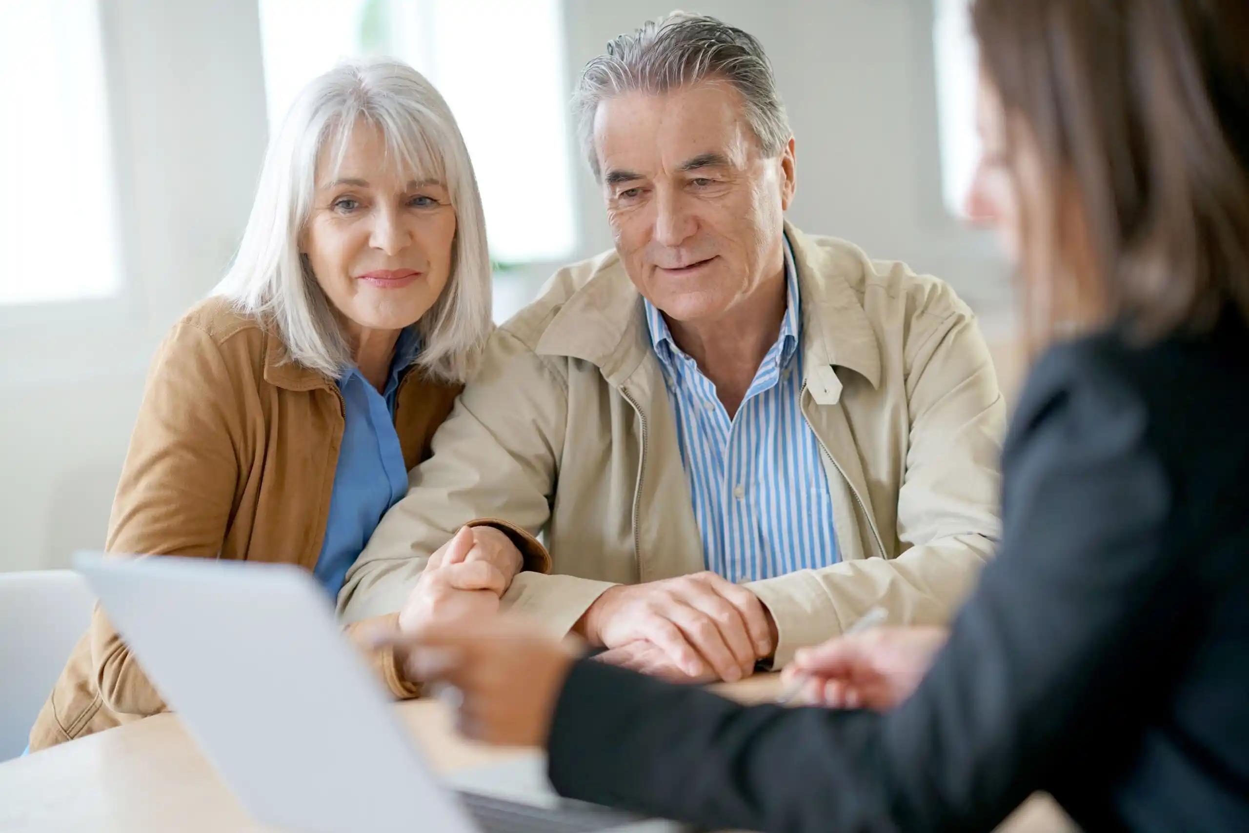 Retiring Couple Discussing Finances with Professional