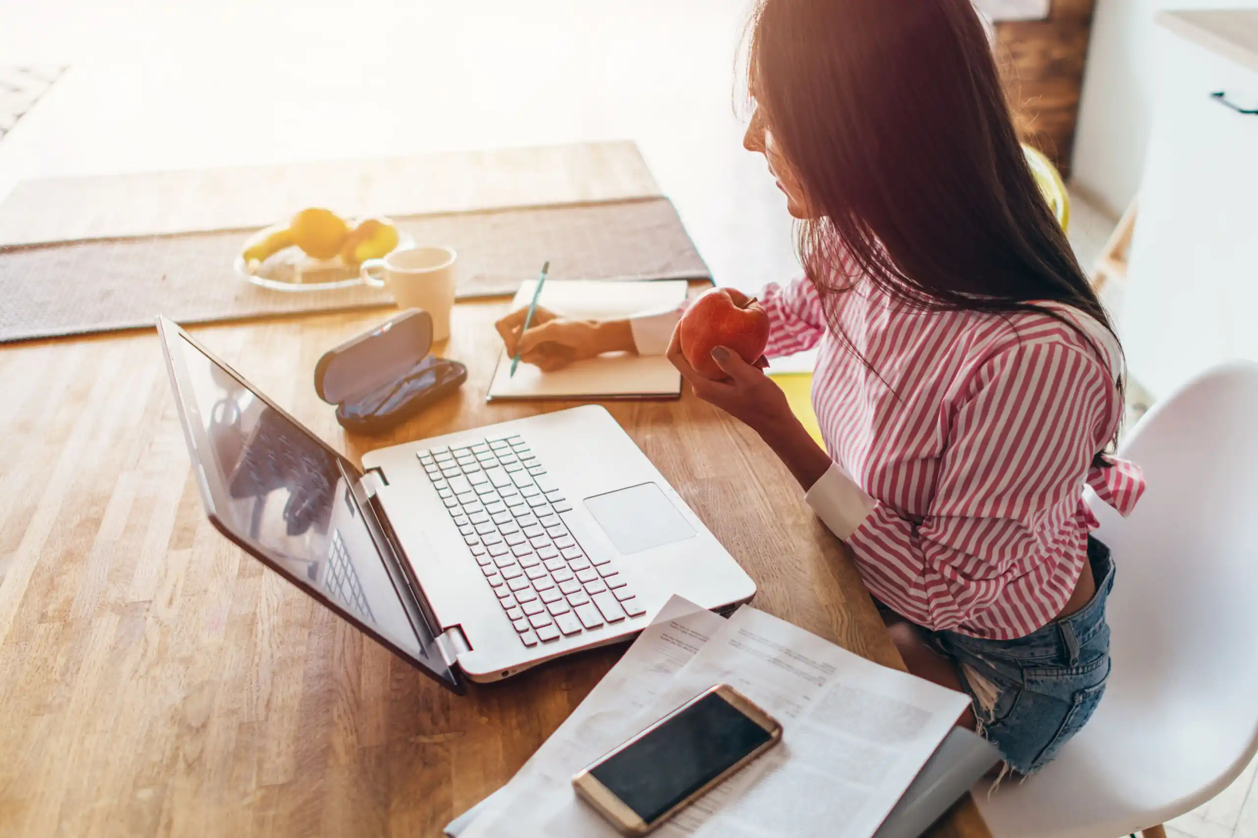 Woman Working on Budget at Desk