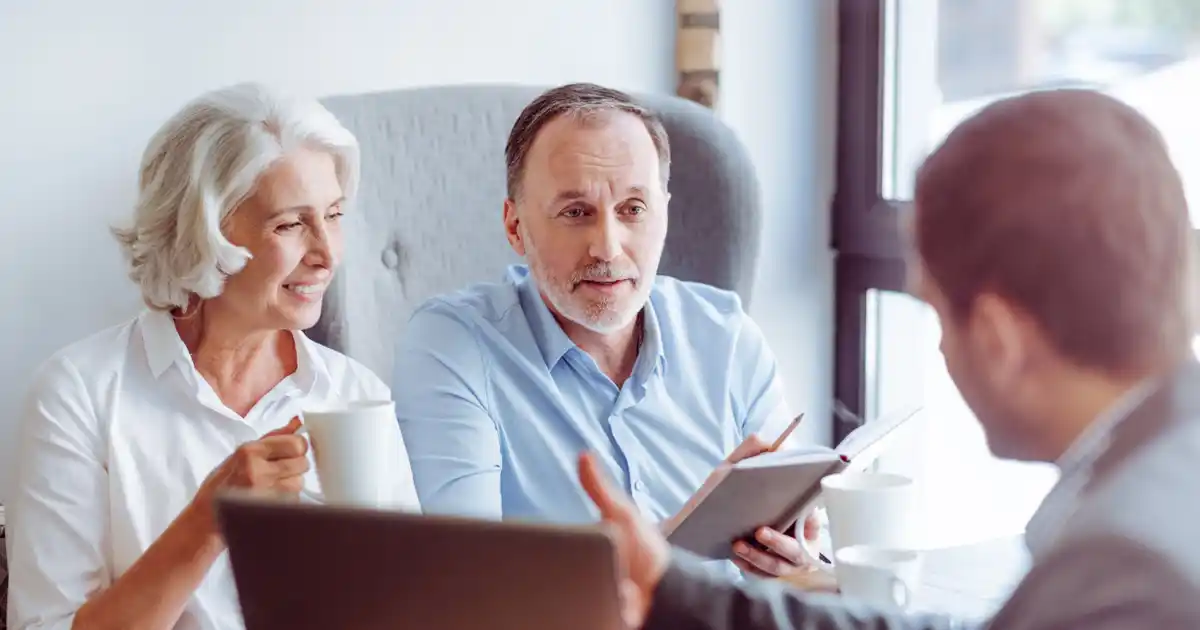 Older Couple Discussing Finances with Advisor