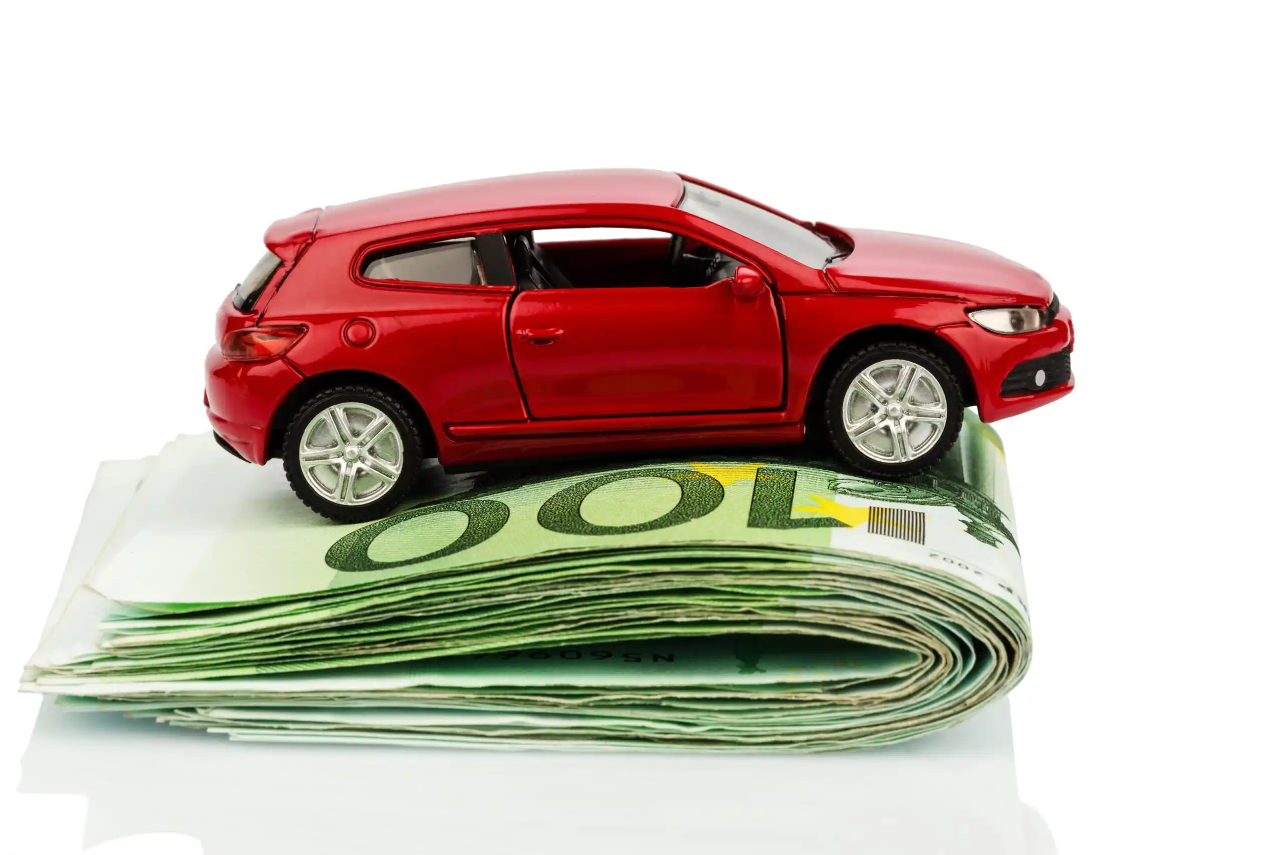 Red Toy Car on Folded Cash
