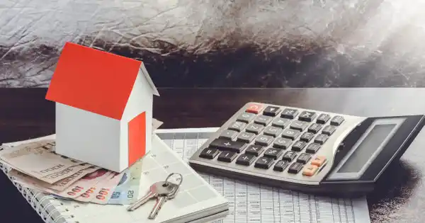 House, Calculator, & Cash on Desktop