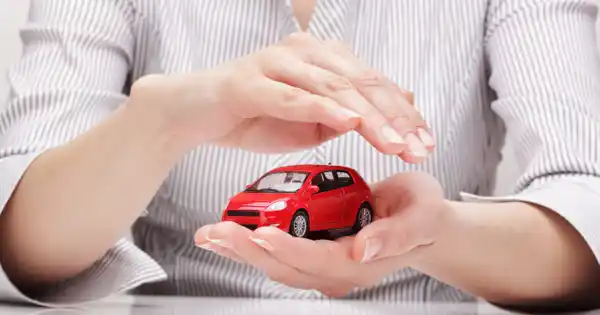 Woman Holding Mini Red Car