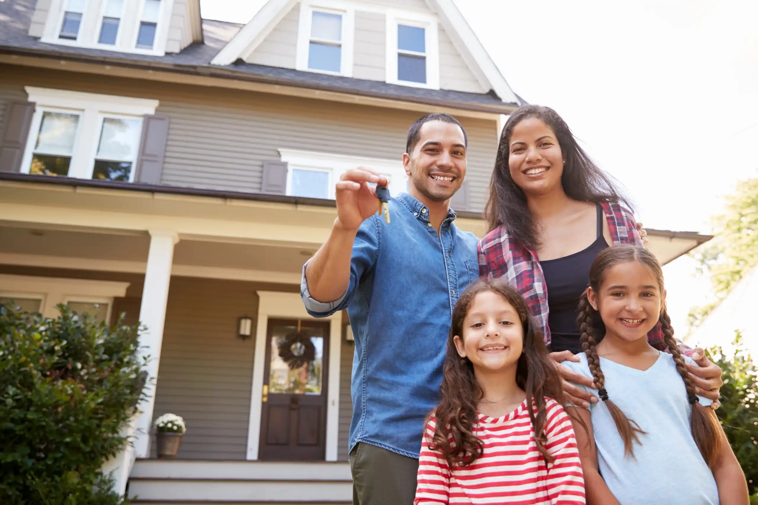 Happy Family with Keys to New Home