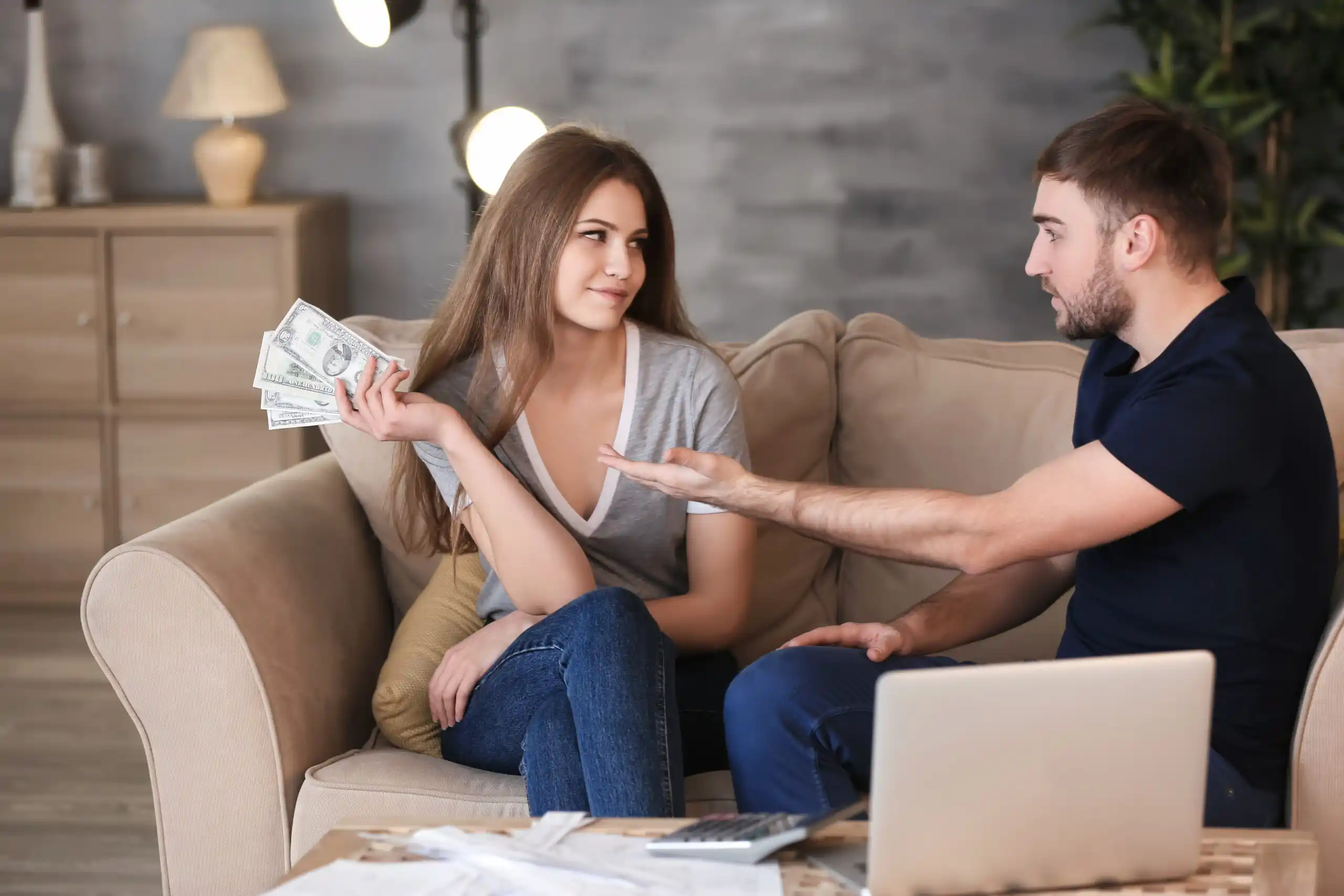 Man Asking for Money and Woman Withholding Cash