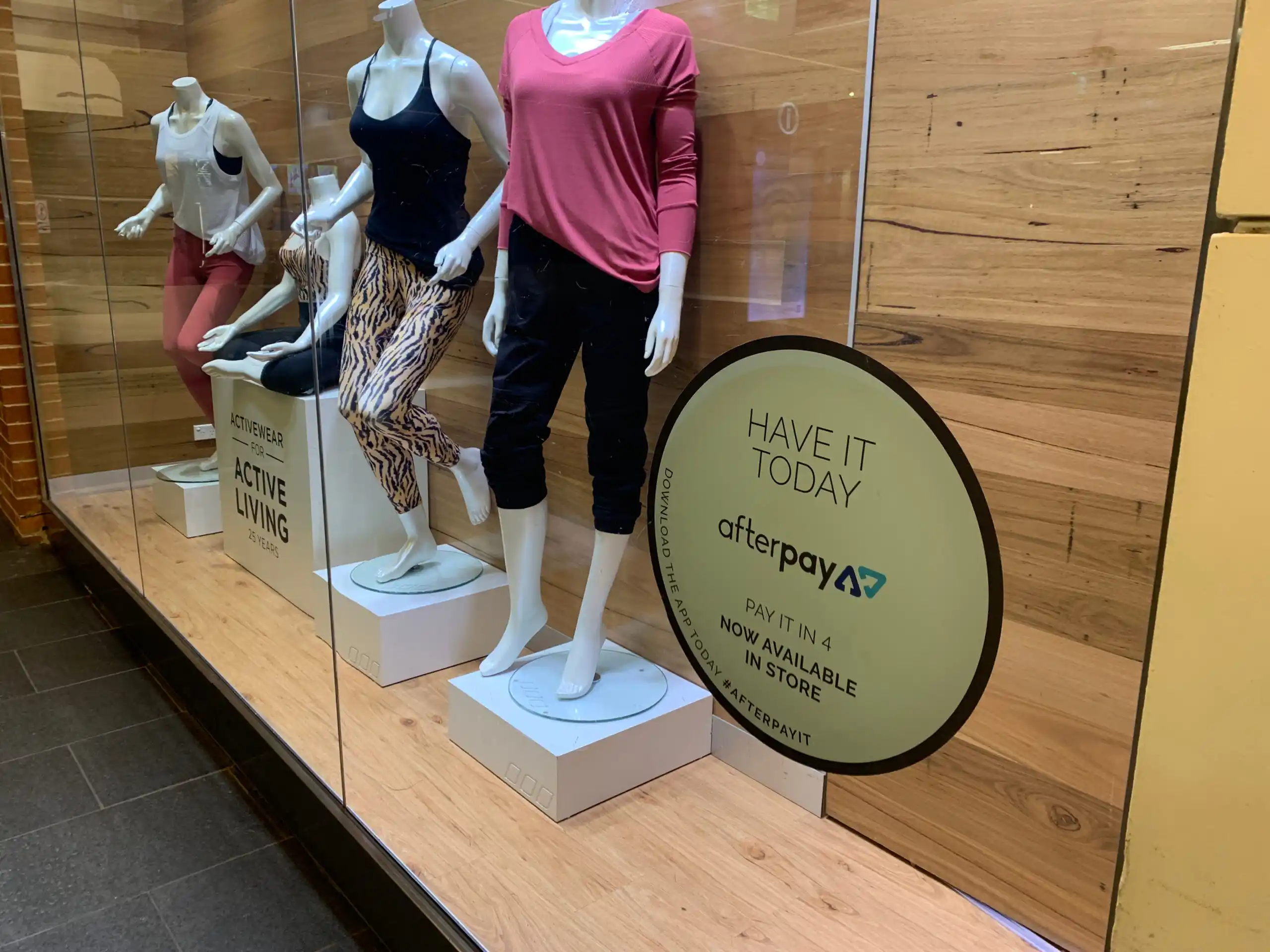 Store Display Window with Buy Now Pay Later Sign