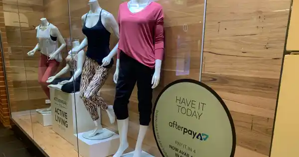 Store Display Window with Buy Now Pay Later Sign