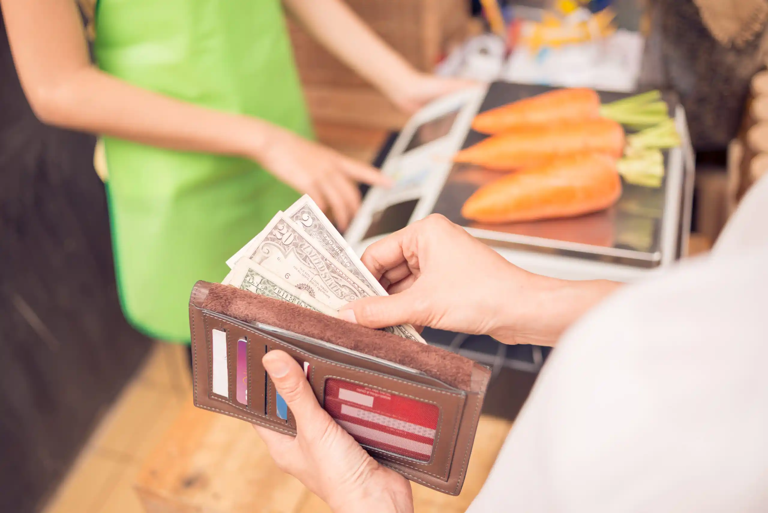 Woman Paying for Groceries at Checkout