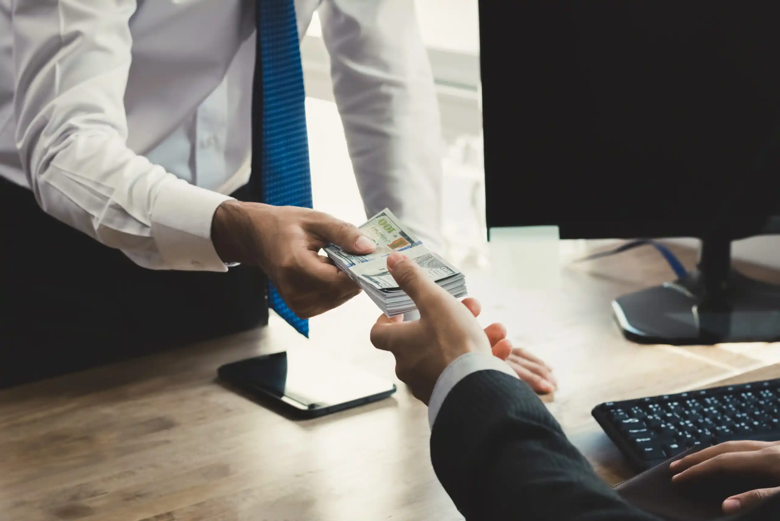 Lender Exchanging Cash with Client