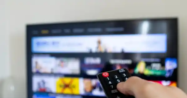 Person Browsing TV App with Remote