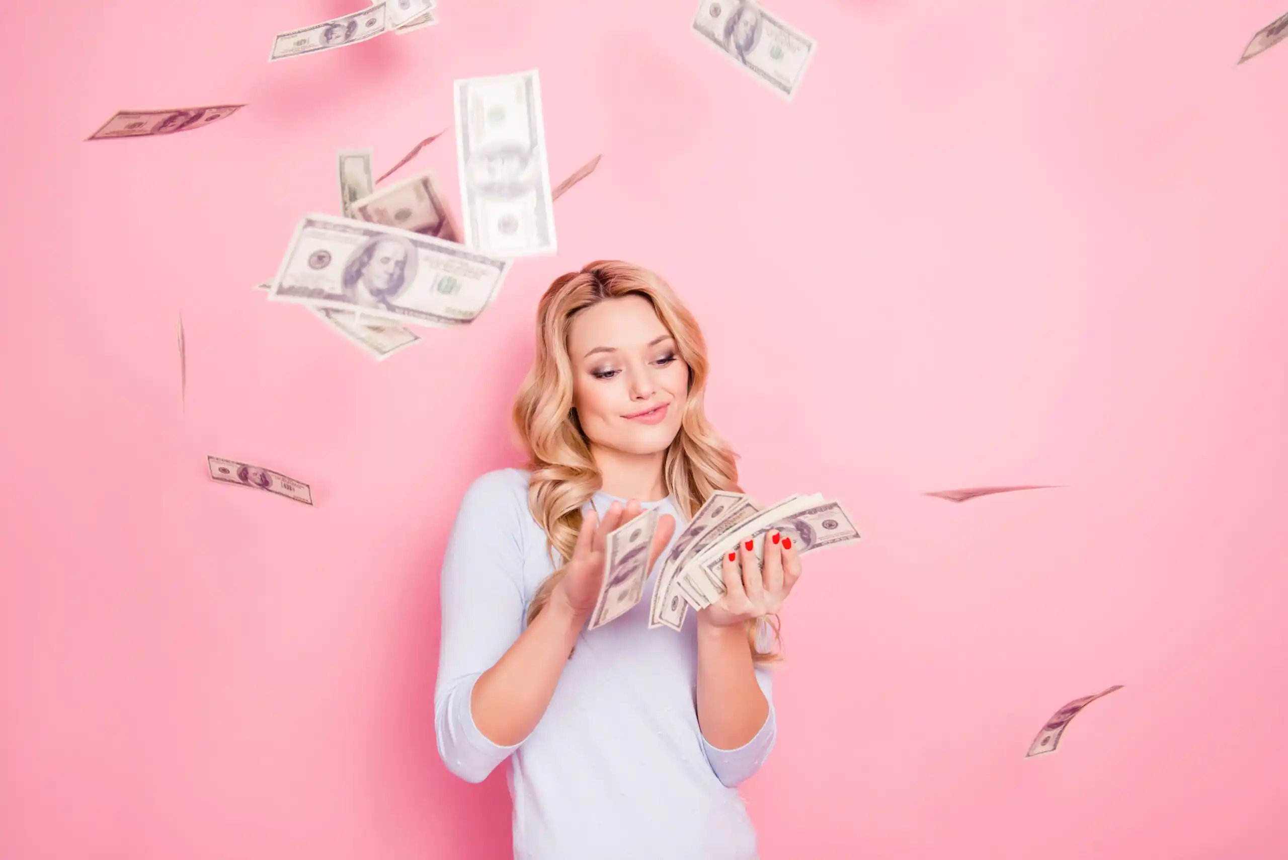 Young woman with extra cash