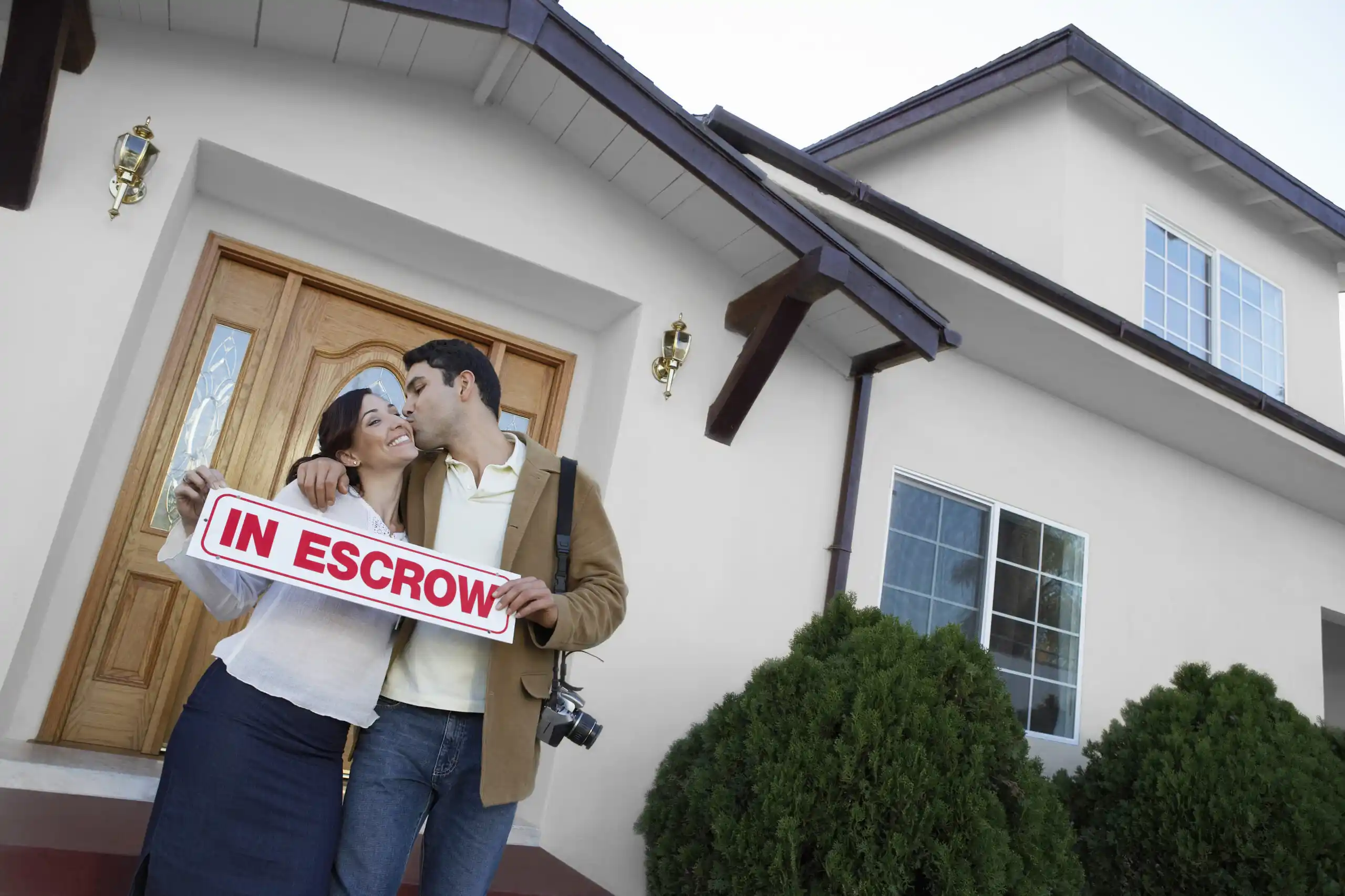 Couple buying home in escrow