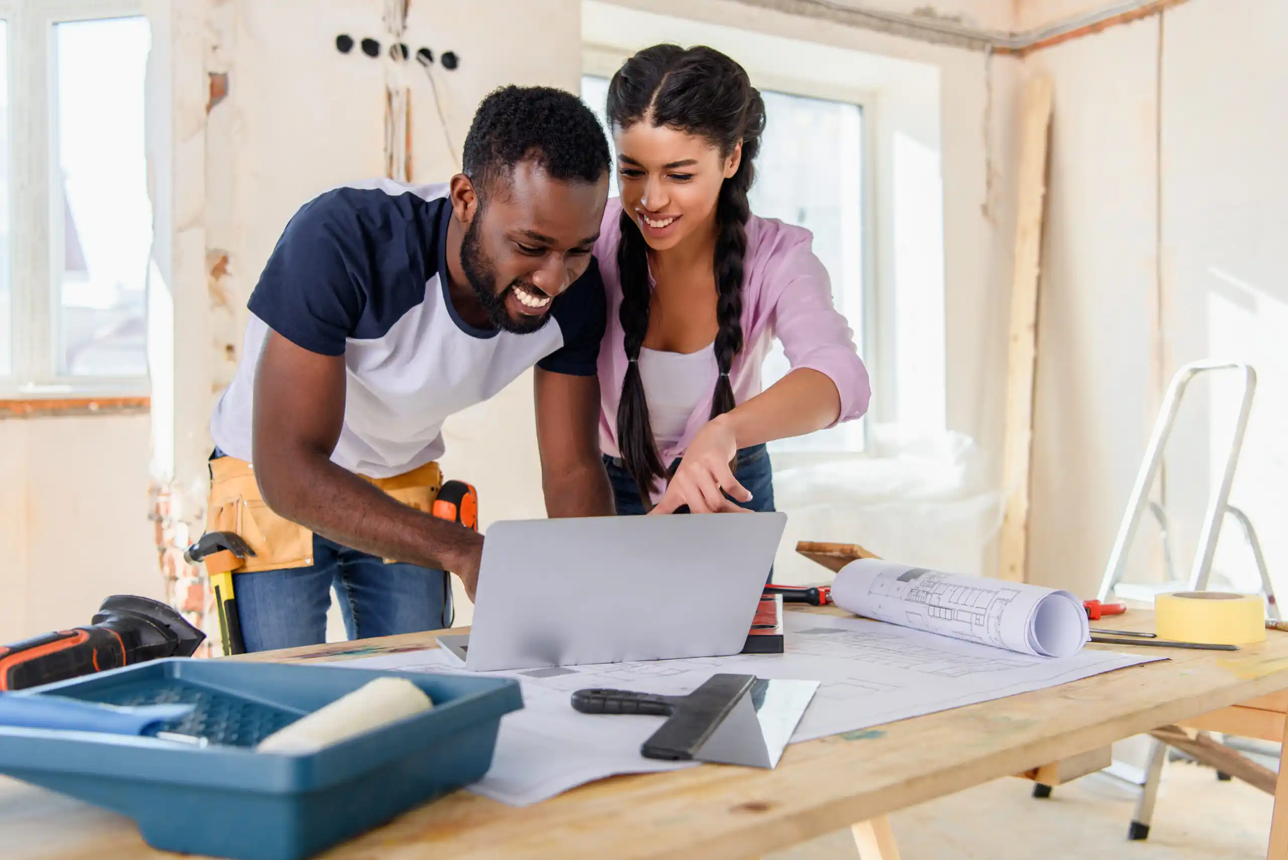 Young couple redecorating their house