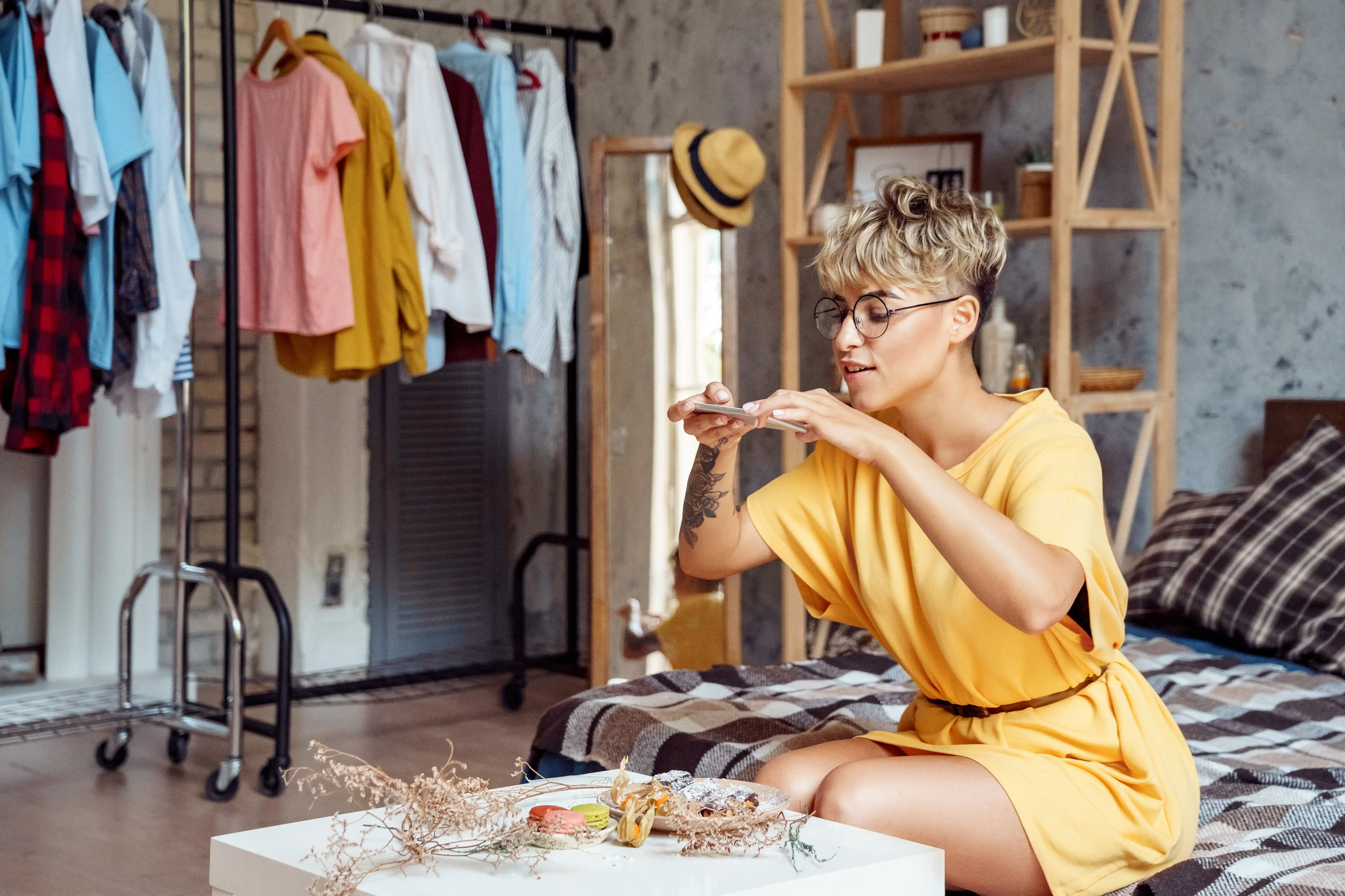 Young woman taking photos of food