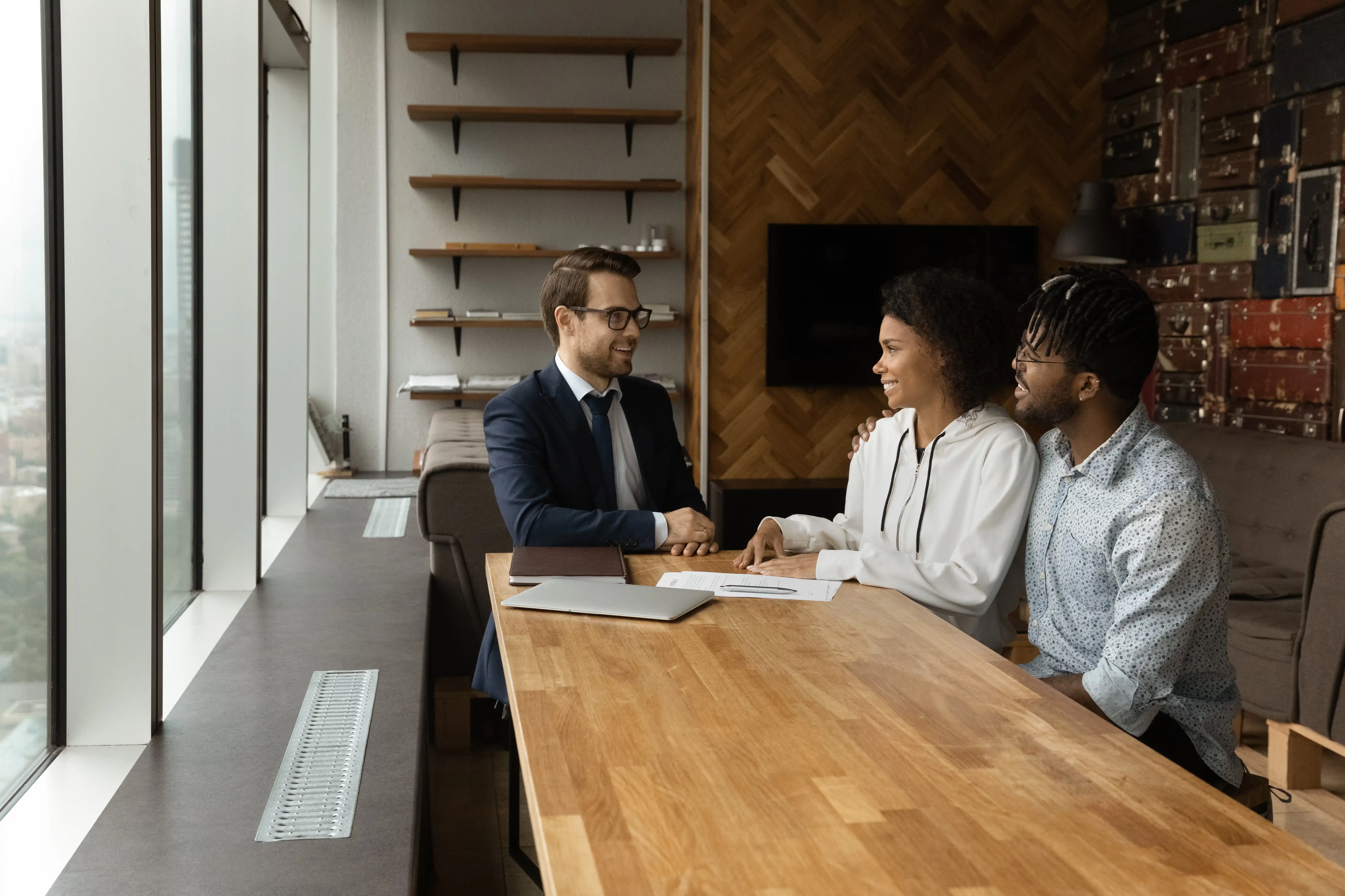 Young couple talking to insurance agent