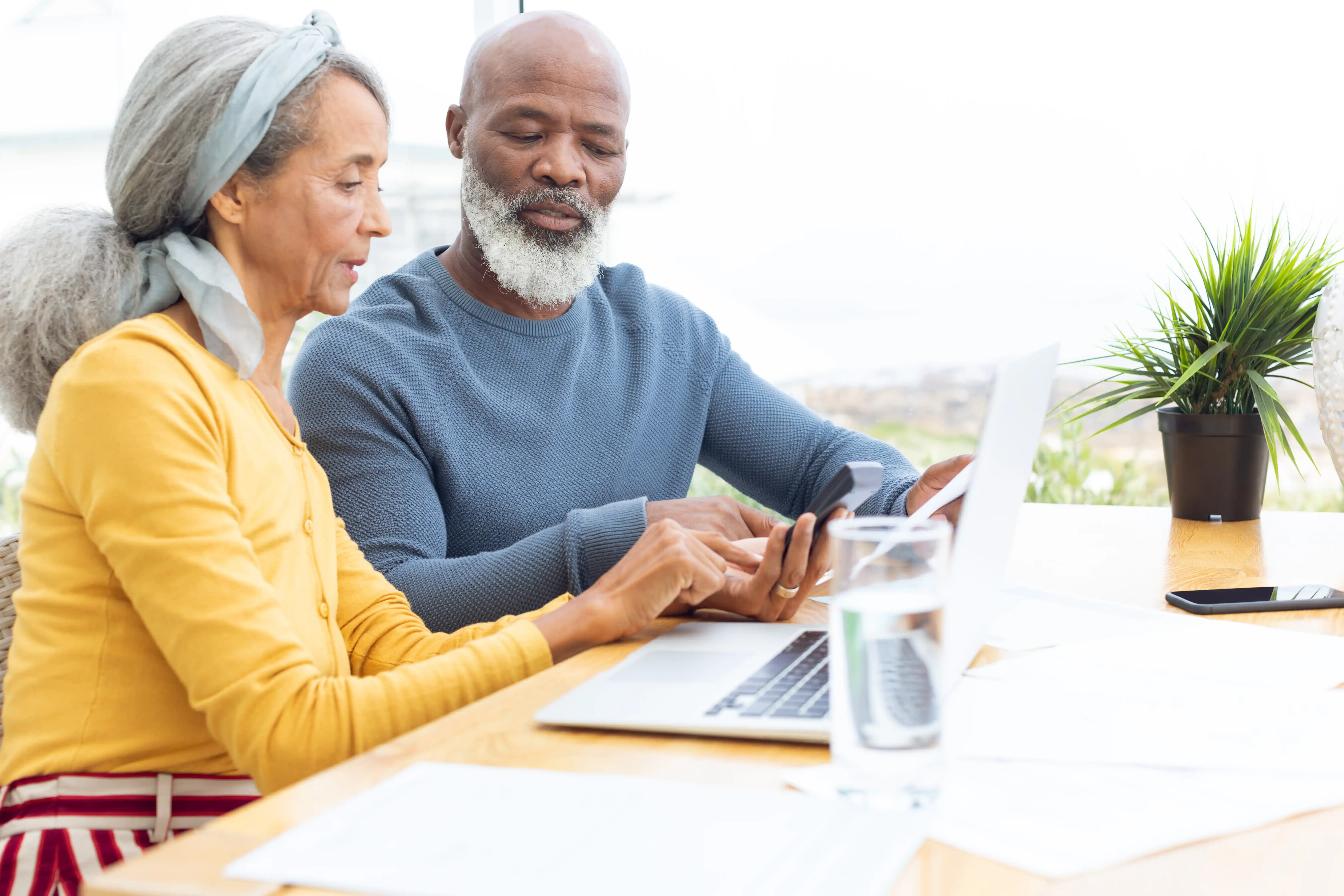 Retired couple checking their investments