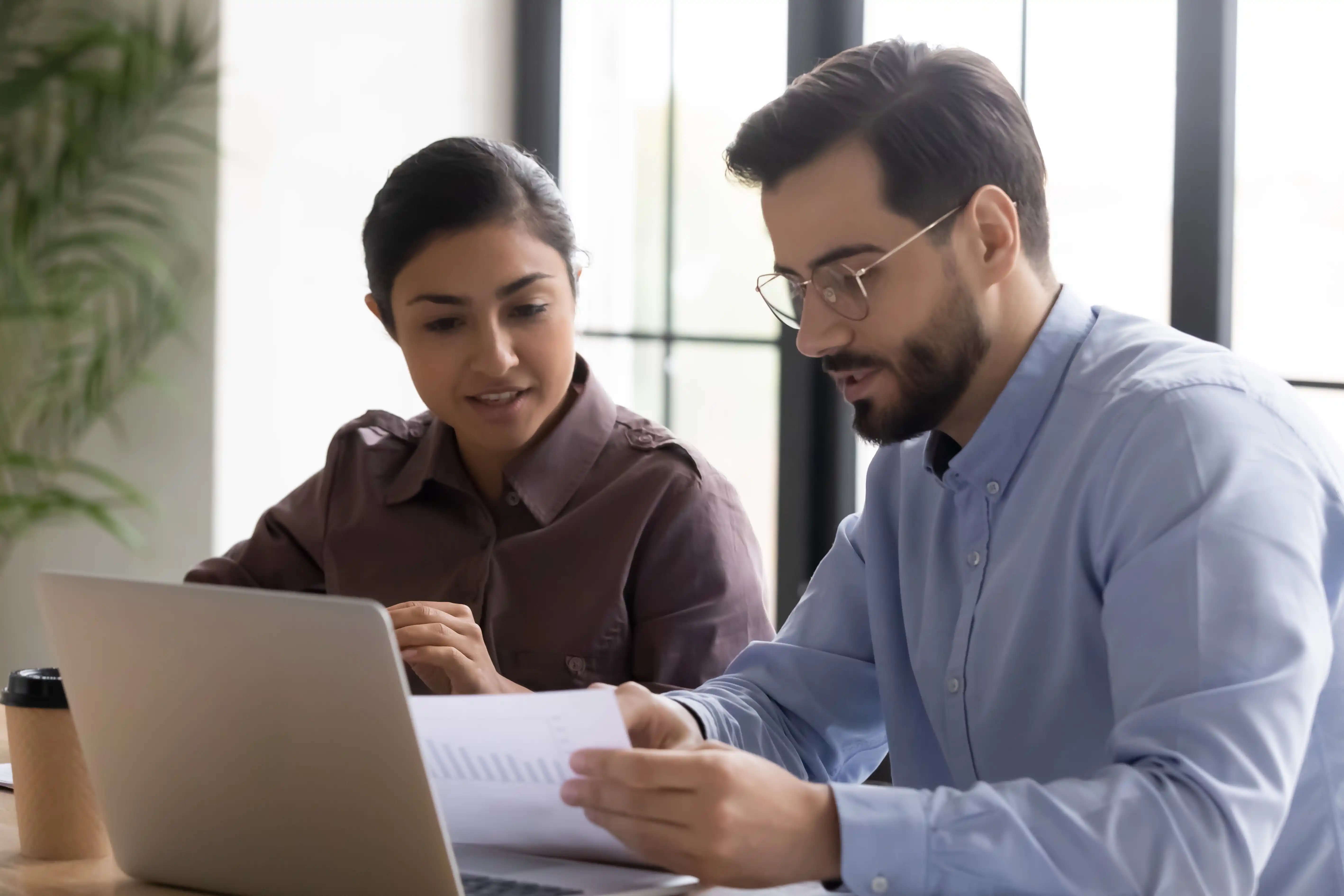 Employees looking over financial records