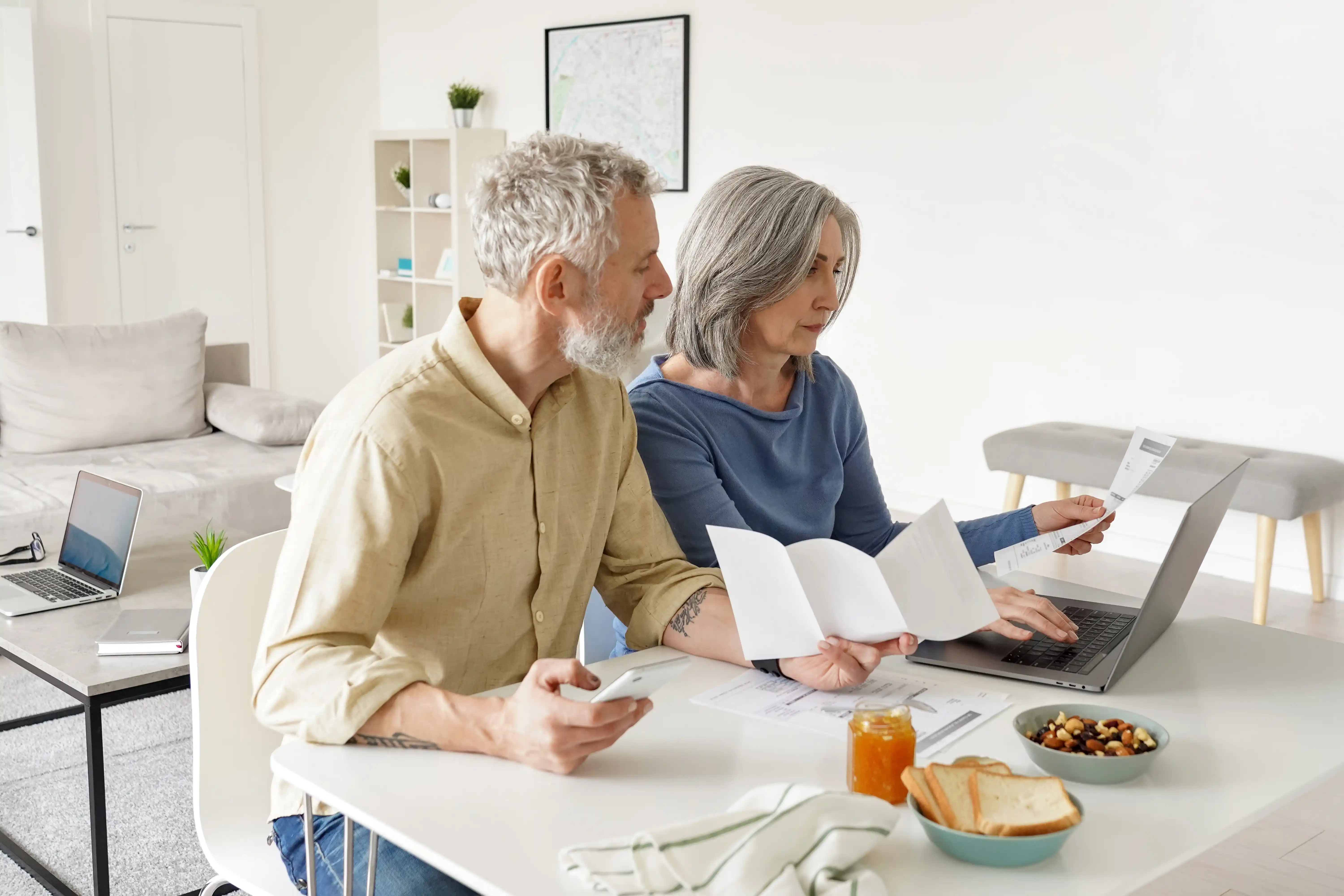 Retired couple looking at their budget