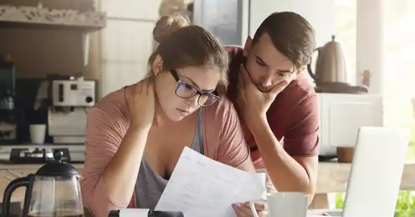 Young couple worrying about bills and budgeting