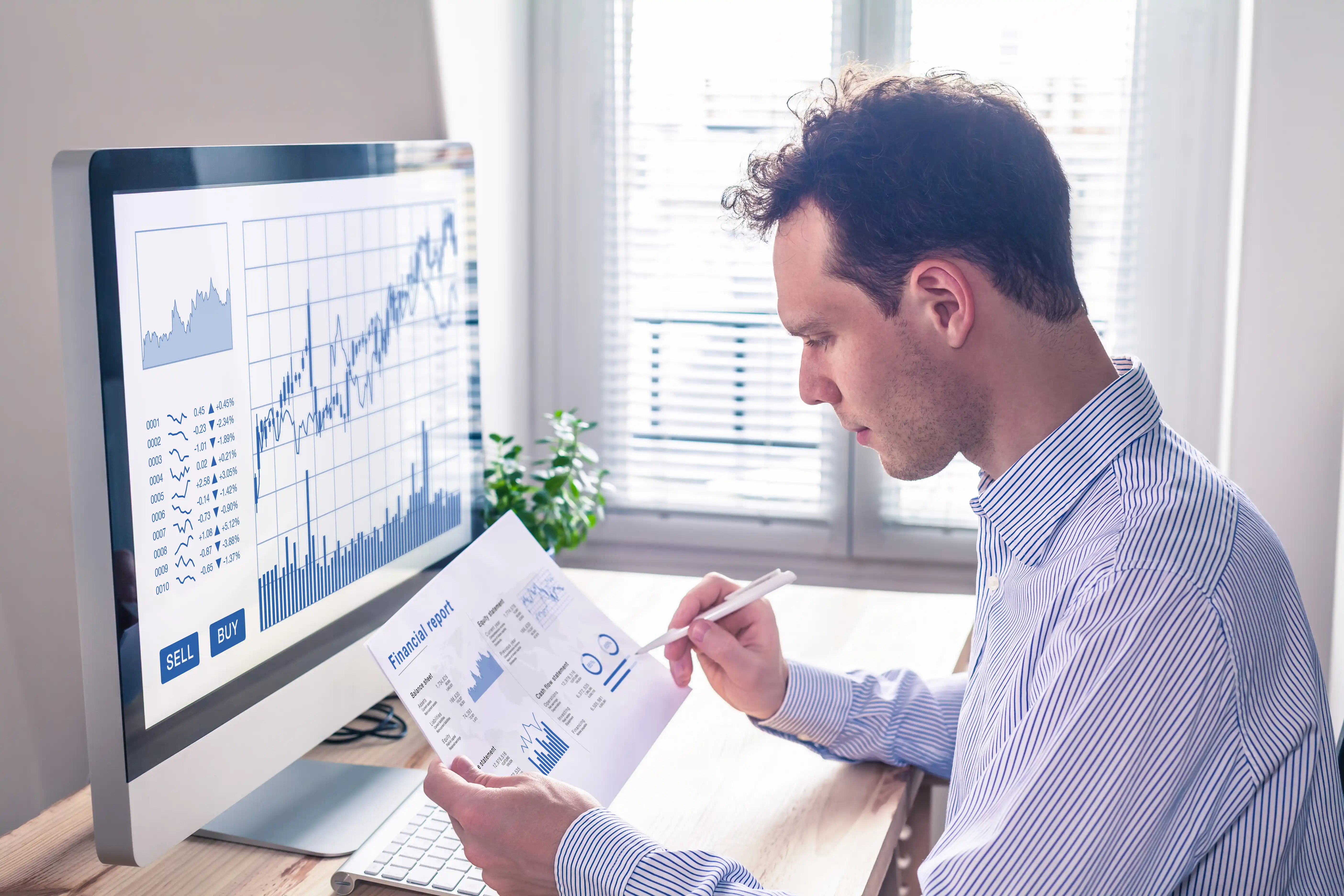 young man checking his dividend investments