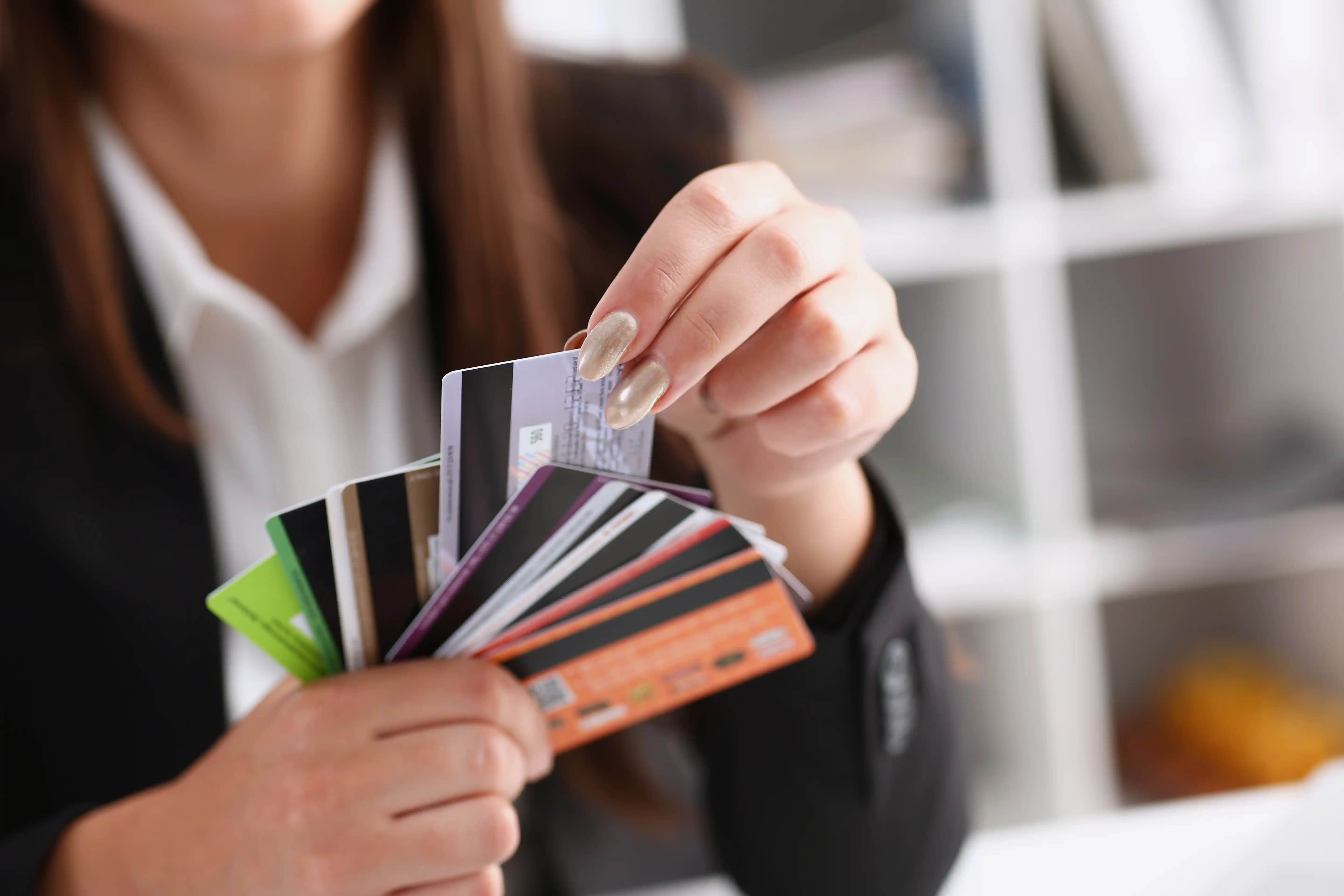 Young woman selecting a credit card