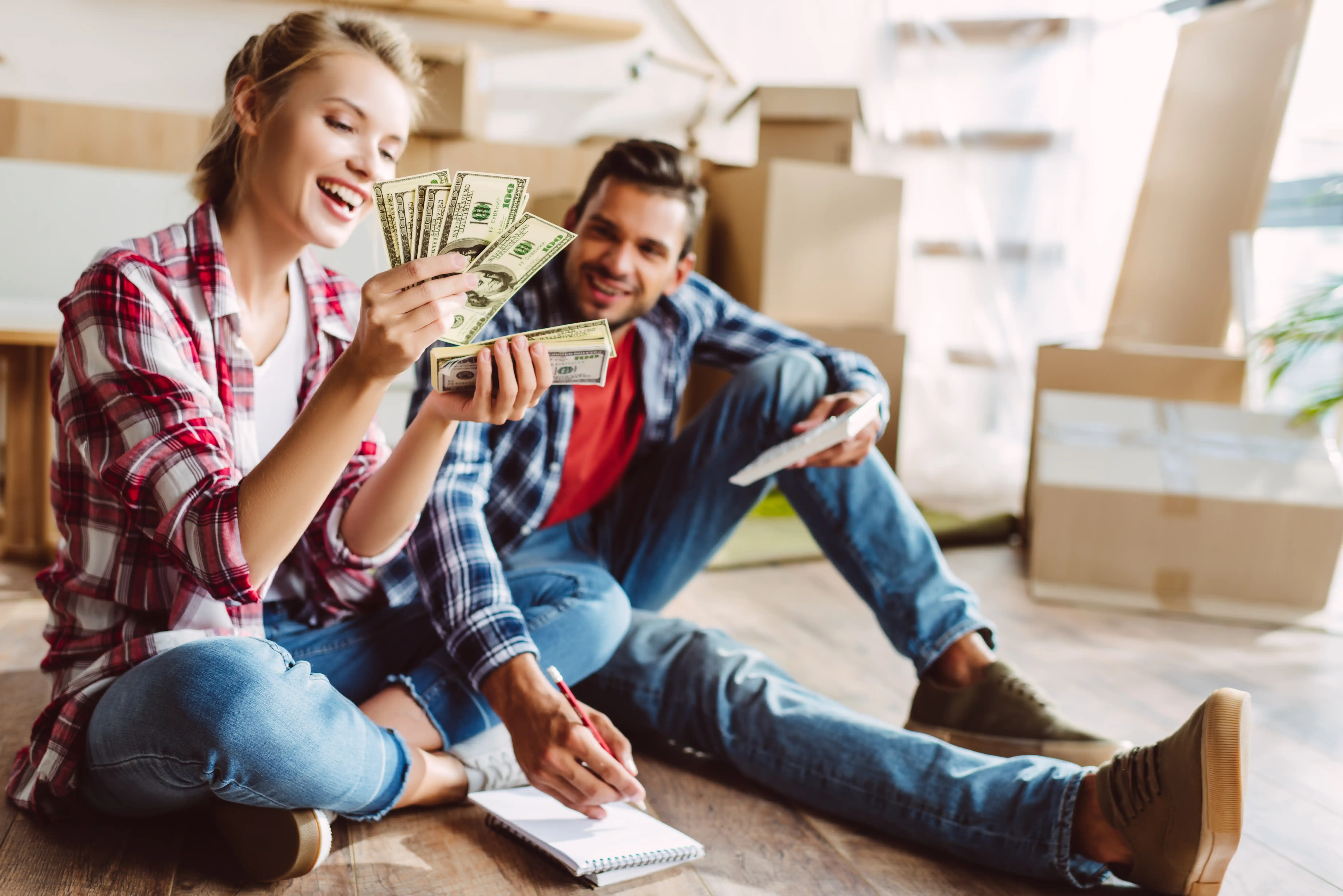 Young couple happy about having extra cash